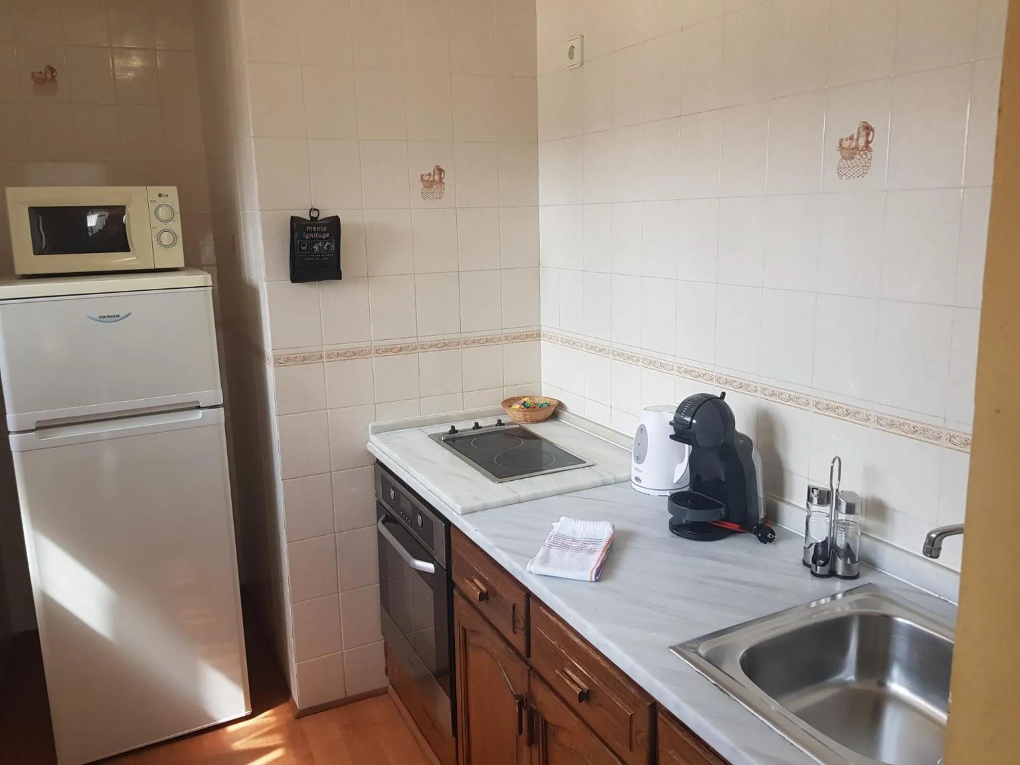 Kitchen or kitchenette in Apartamentos Parot Quality