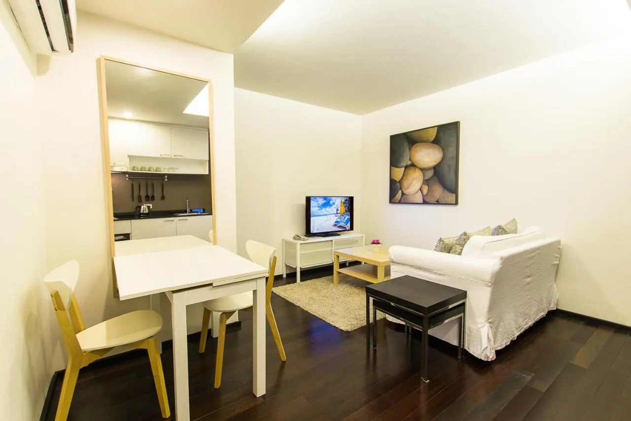 Living room, Bed in The Title Comfort Condotel