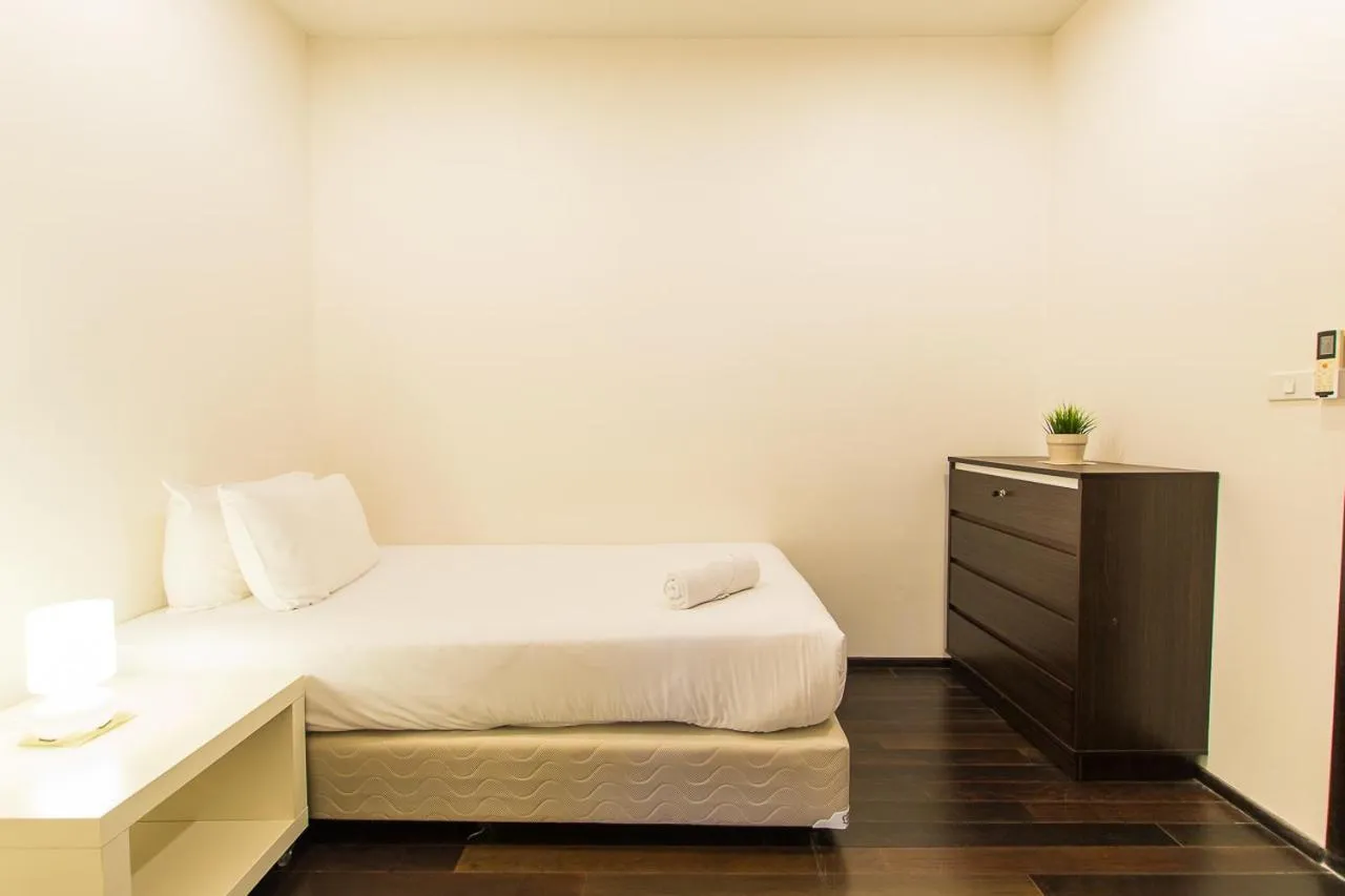 Photo of the whole room, Bed in The Title Comfort Condotel