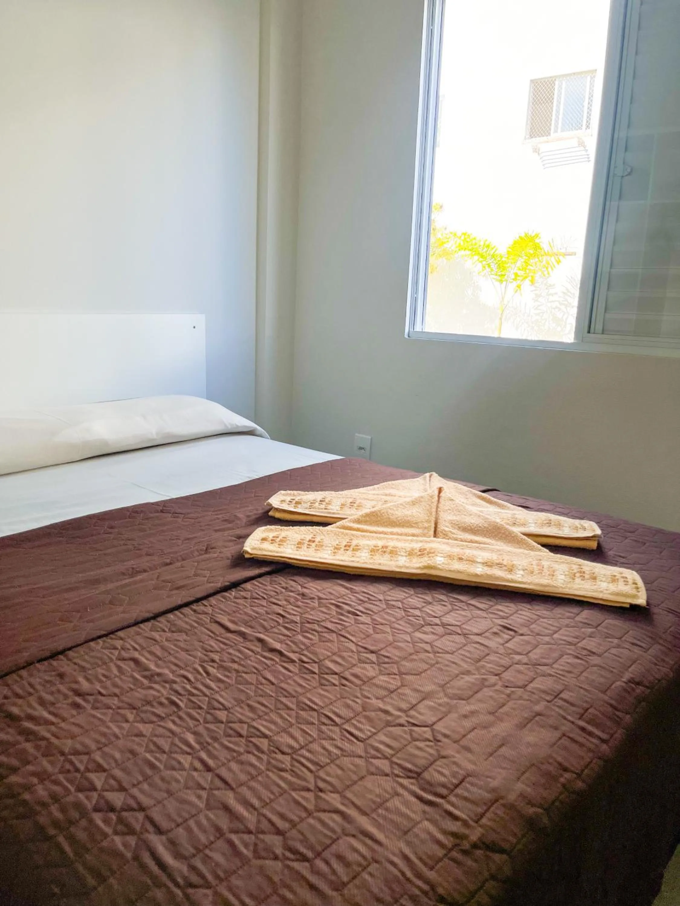 Bed in Pousada Gomes