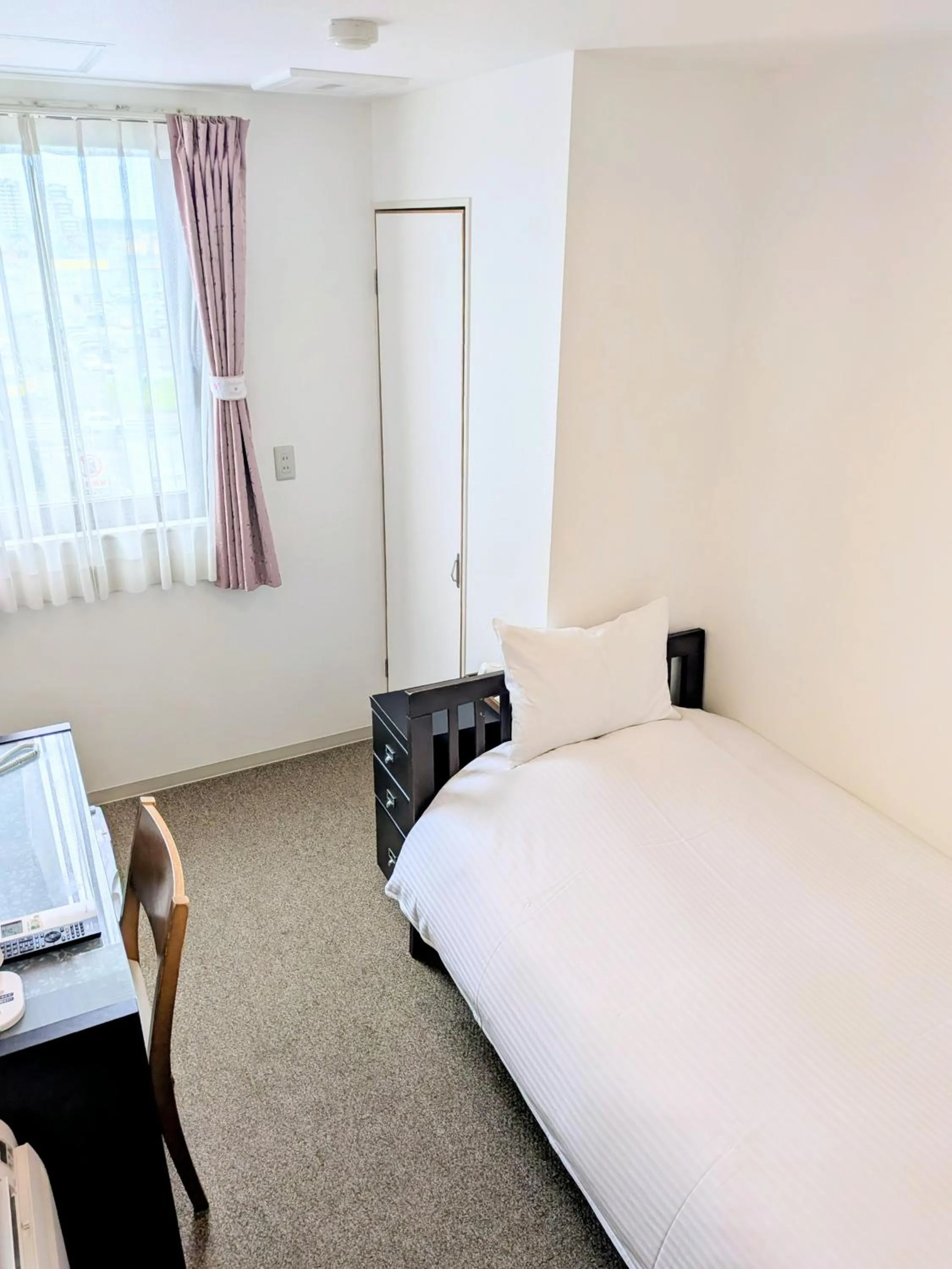 Bed in Sakura Hotel Oami