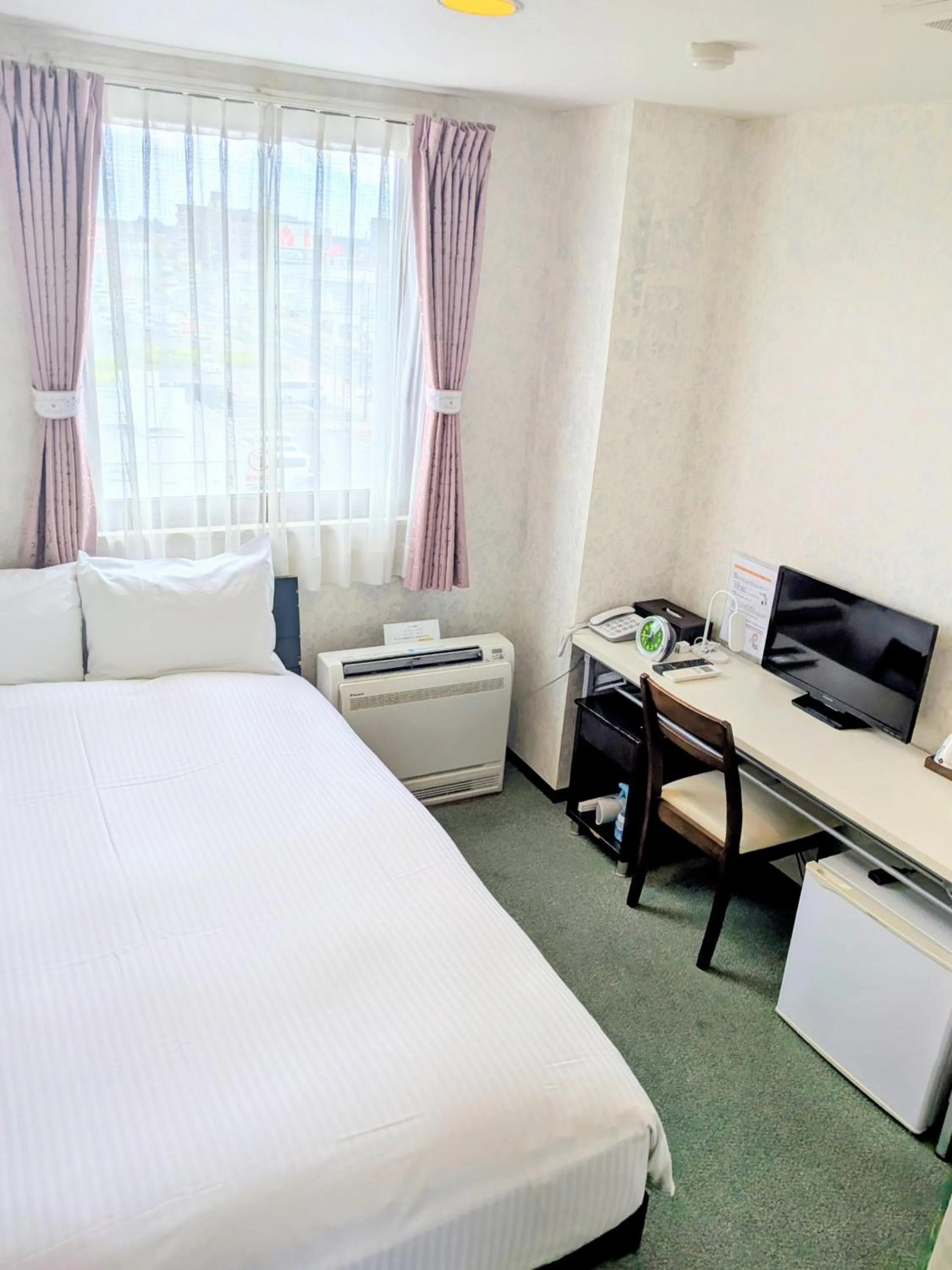 Bed in Sakura Hotel Oami