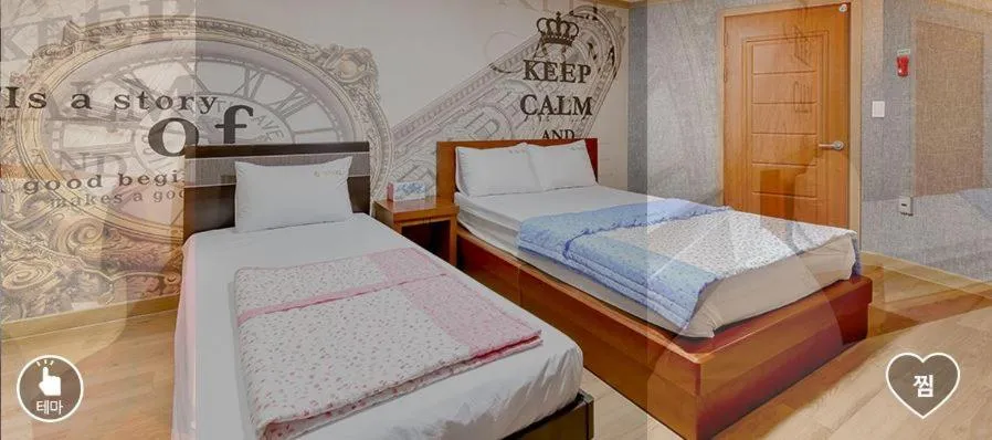 Bed in Happy Q Motel