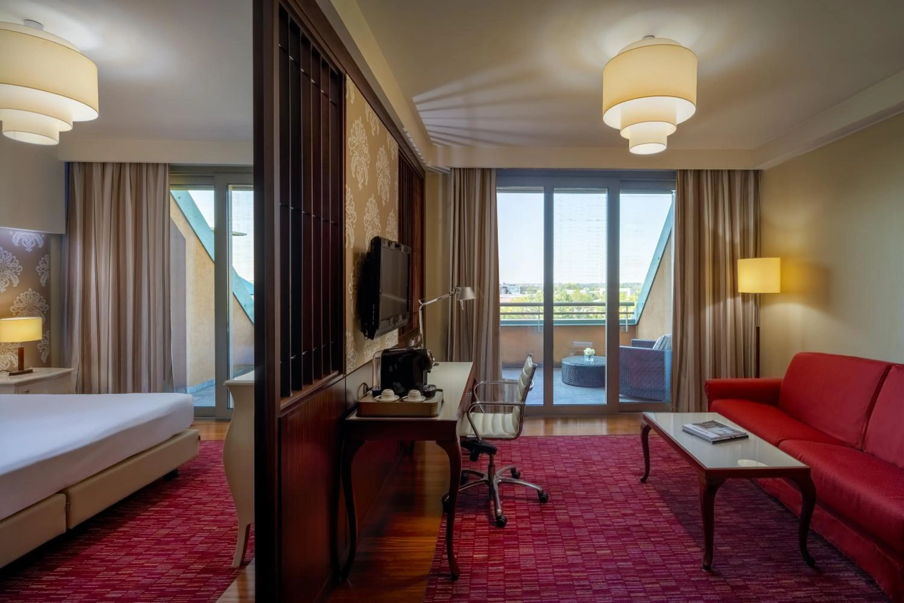 Living room, Bed in UNA Hotels Expo Fiera Milano