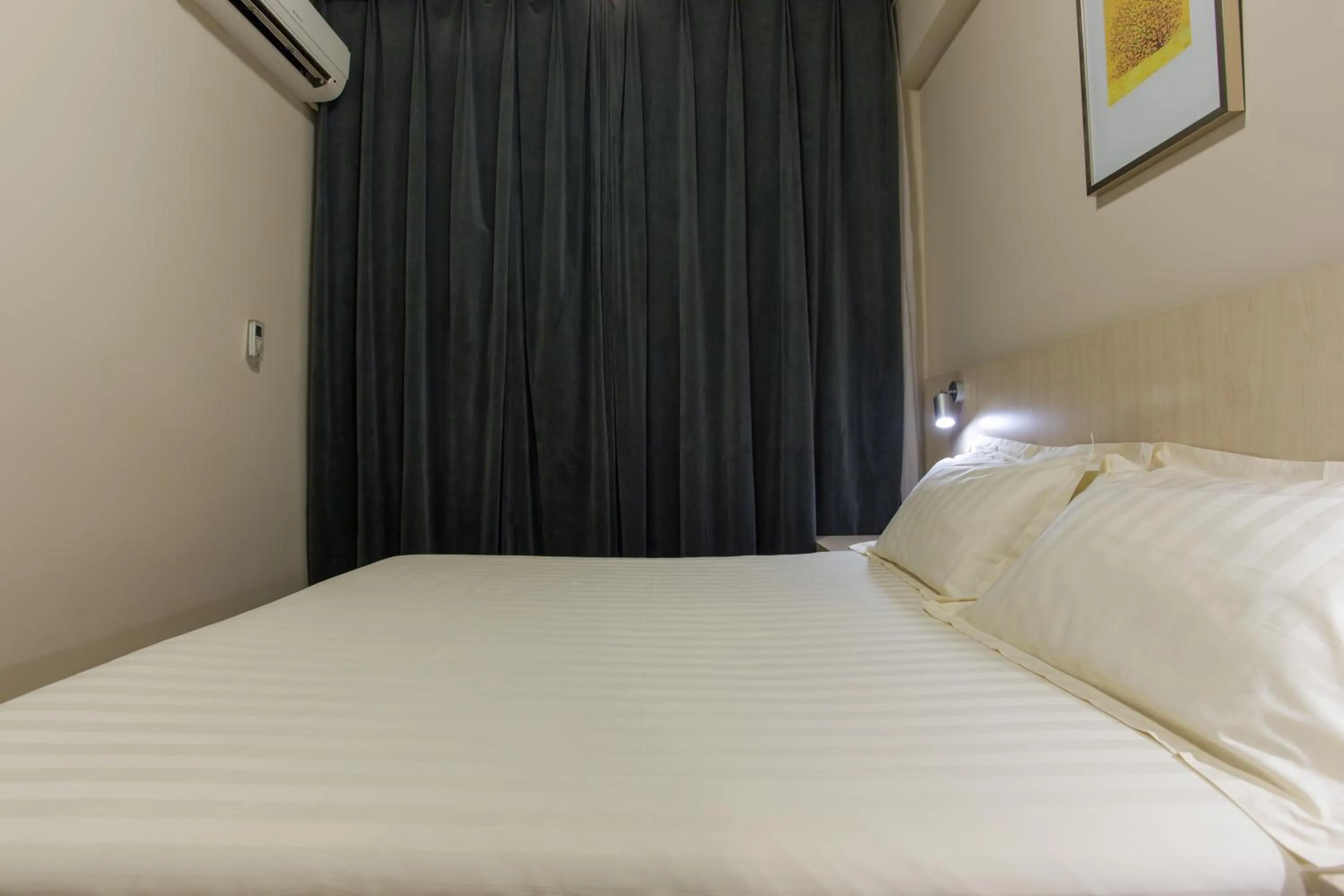 Bed in Jinjiang Inn Beijing Hepingmen