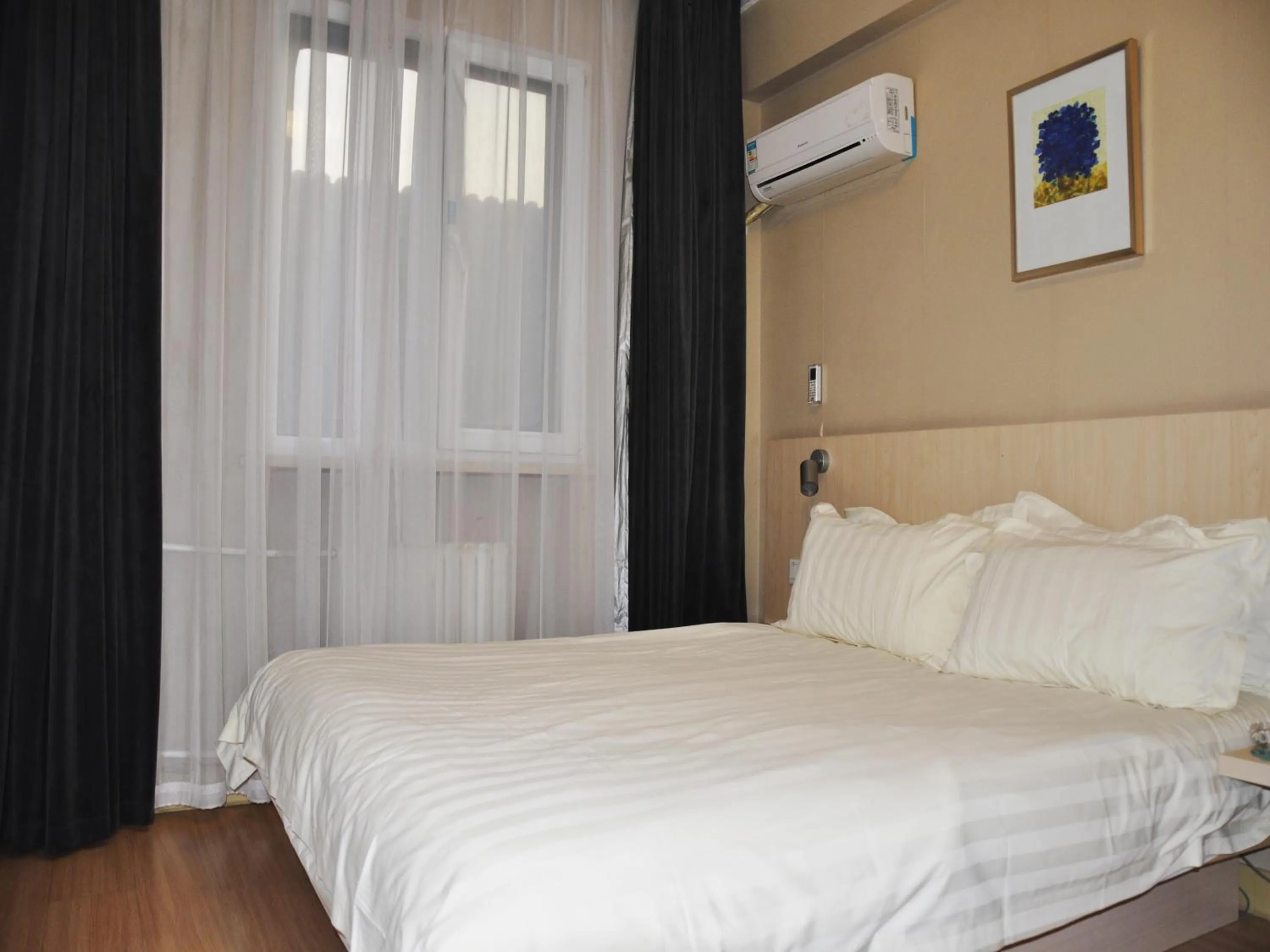 Bed in Jinjiang Inn Beijing Hepingmen