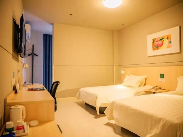 Bed in Magnolia Hotel Cangzhou West Railway Station Jiefang Road