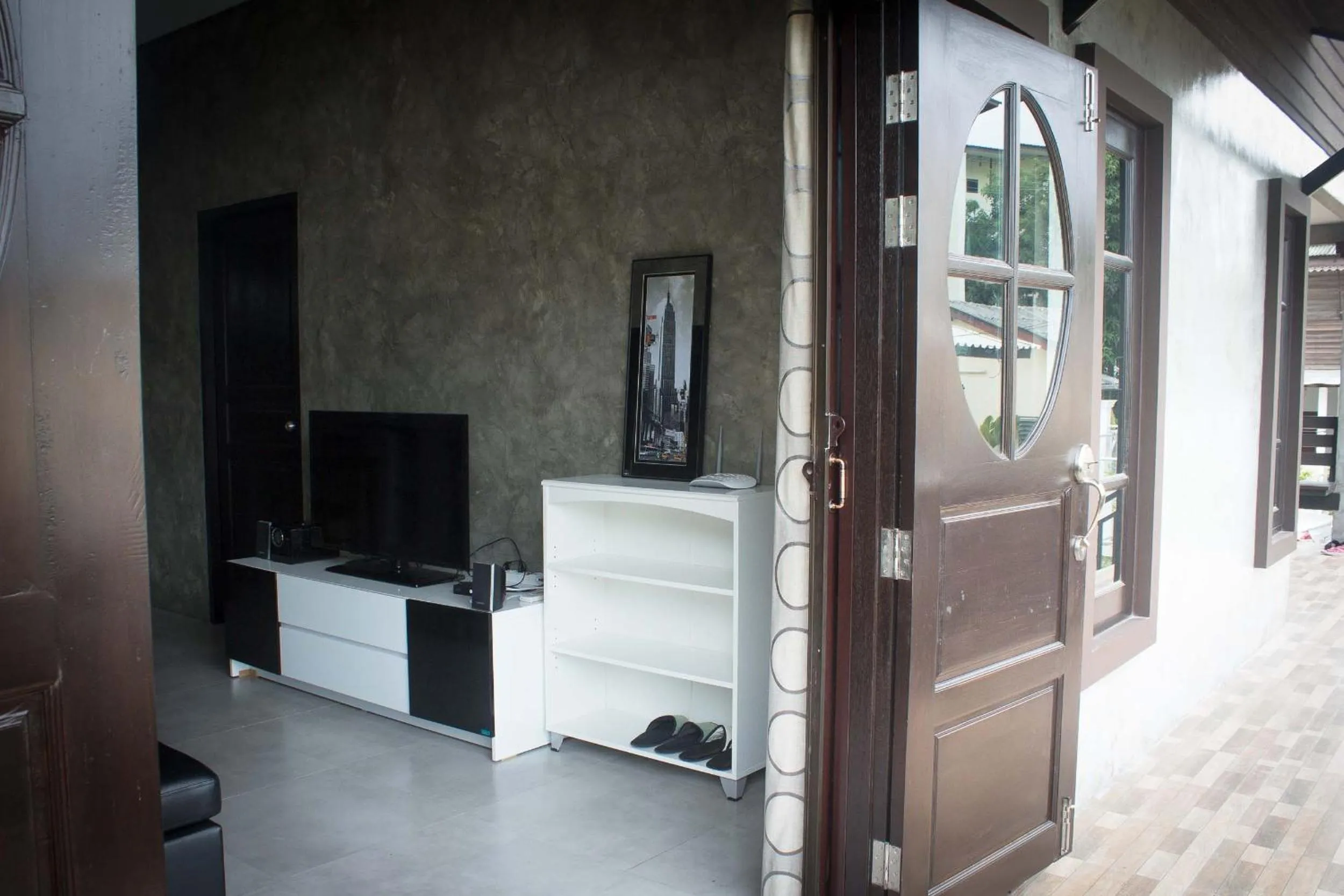 Communal lounge/ TV room in PK Villa Huahin