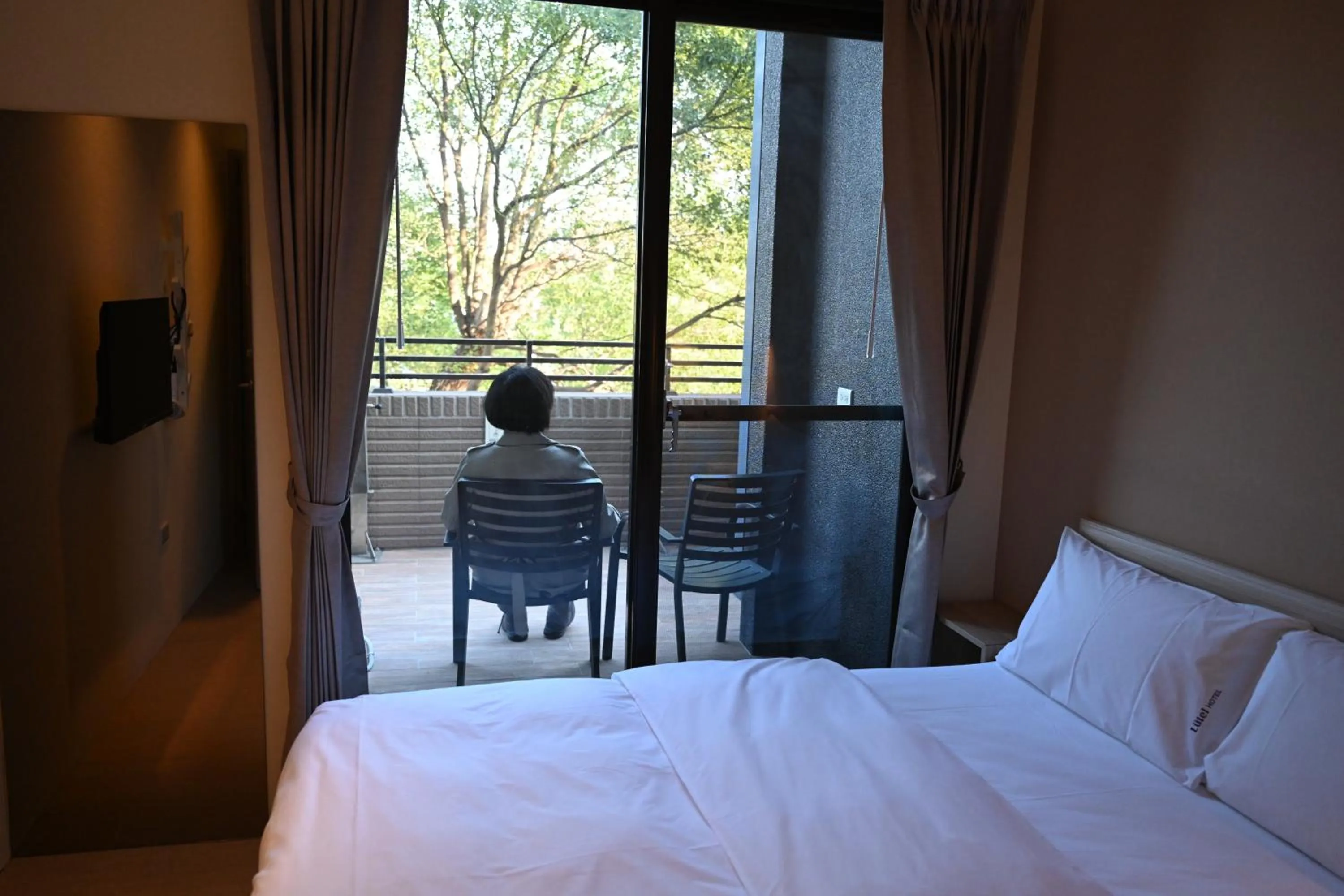 View (from property/room), Bed in Lütel Hotel Xpark Gloria Outlets Shin Kong Cinemas