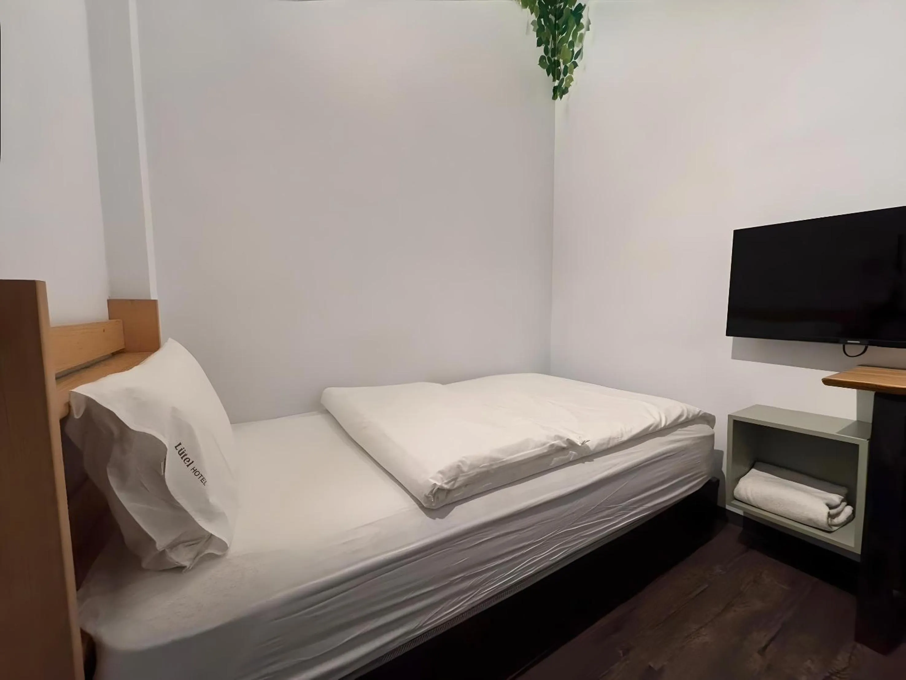 View (from property/room), Bed in Lütel Hotel Xpark Gloria Outlets Shin Kong Cinemas