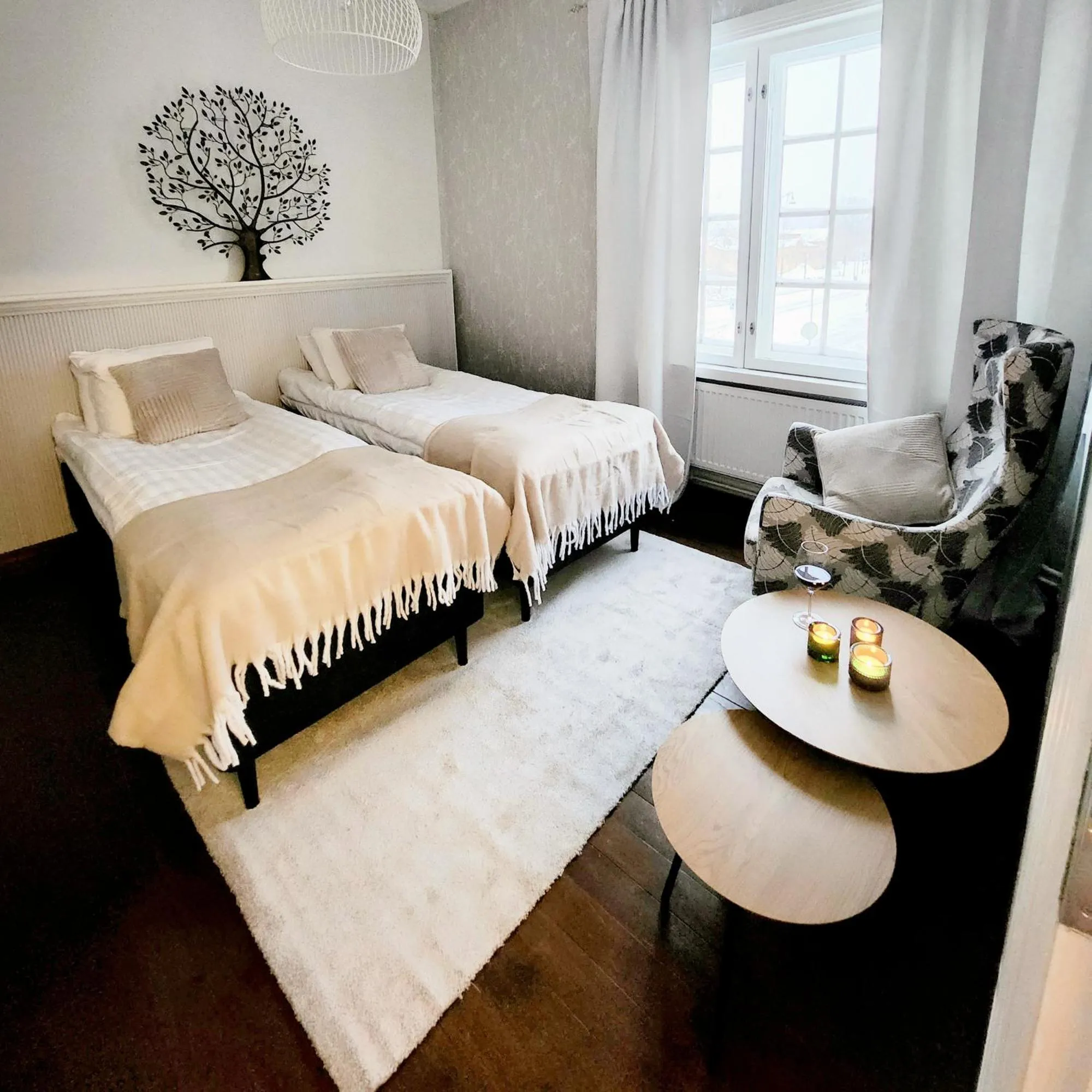 Bed in Harmooni Suites