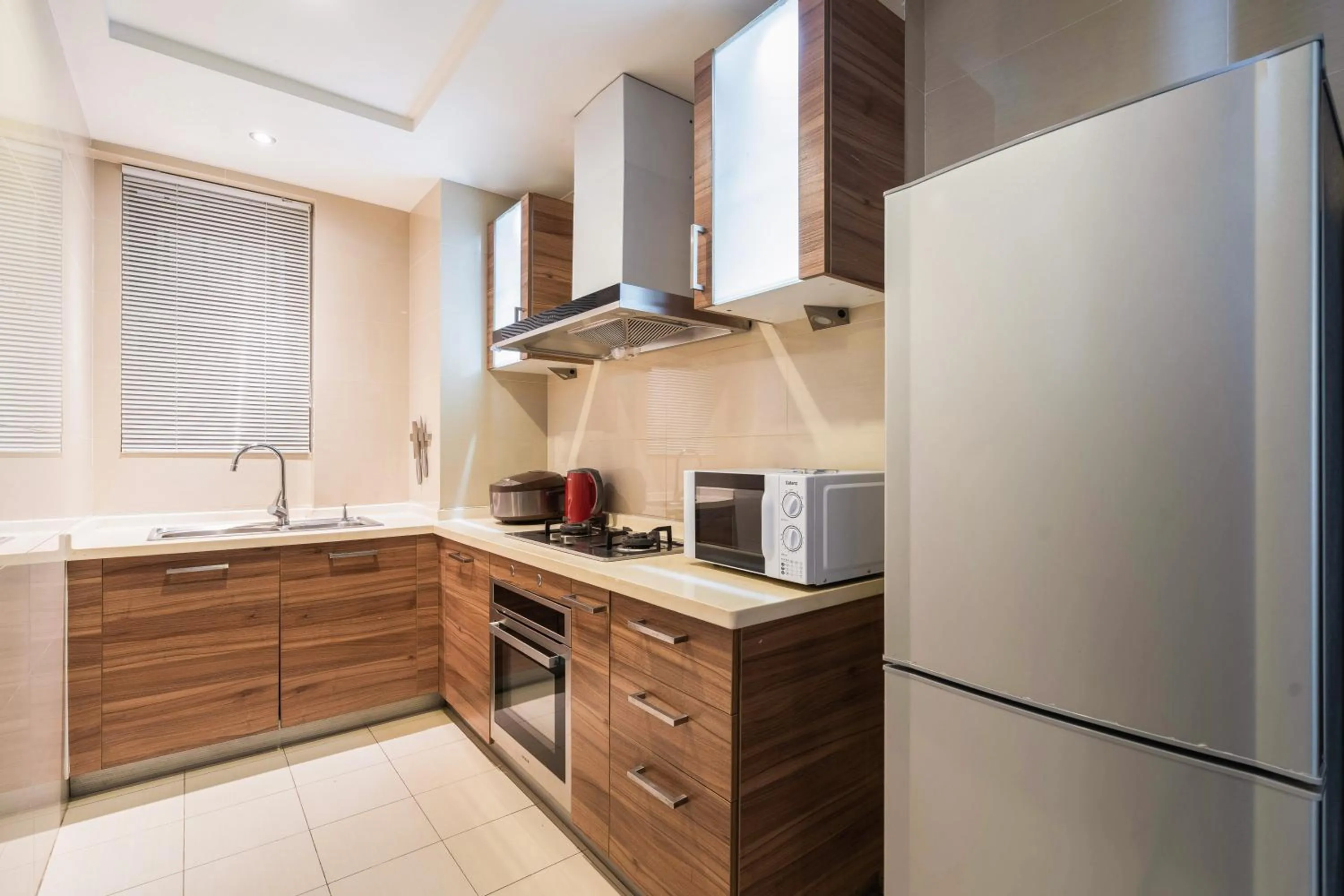 Kitchen or kitchenette in Sanya Yikehai View Apartments