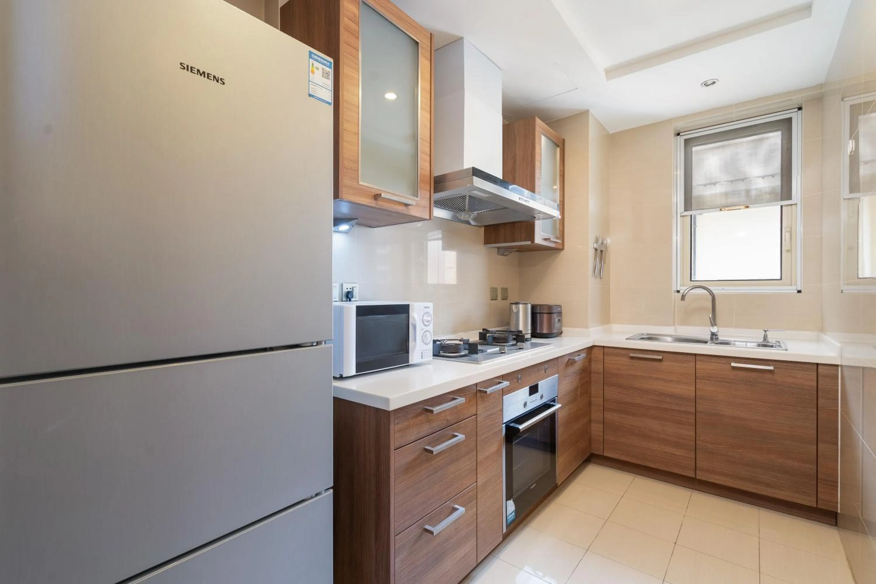 Kitchen or kitchenette in Sanya Yikehai View Apartments