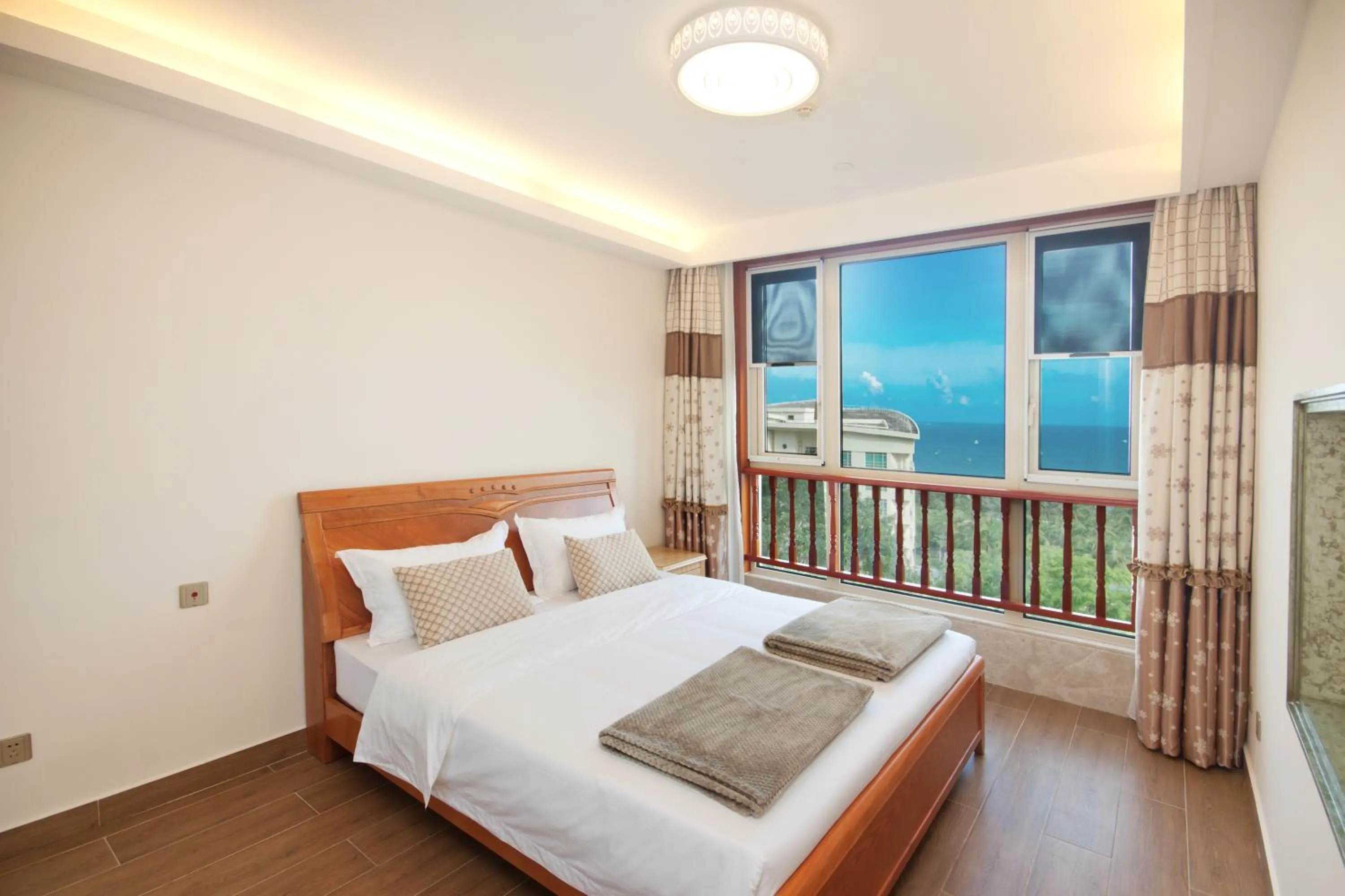 Bedroom, Bed in Sanya Yikehai View Apartments