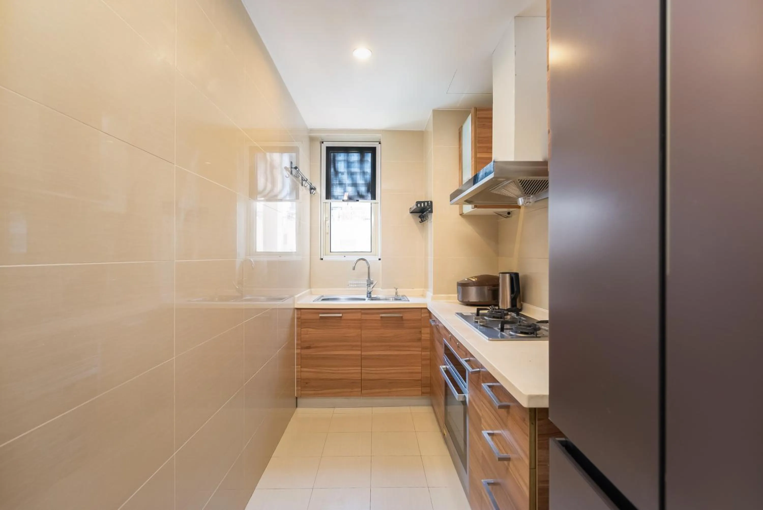 Kitchen or kitchenette in Sanya Yikehai View Apartments
