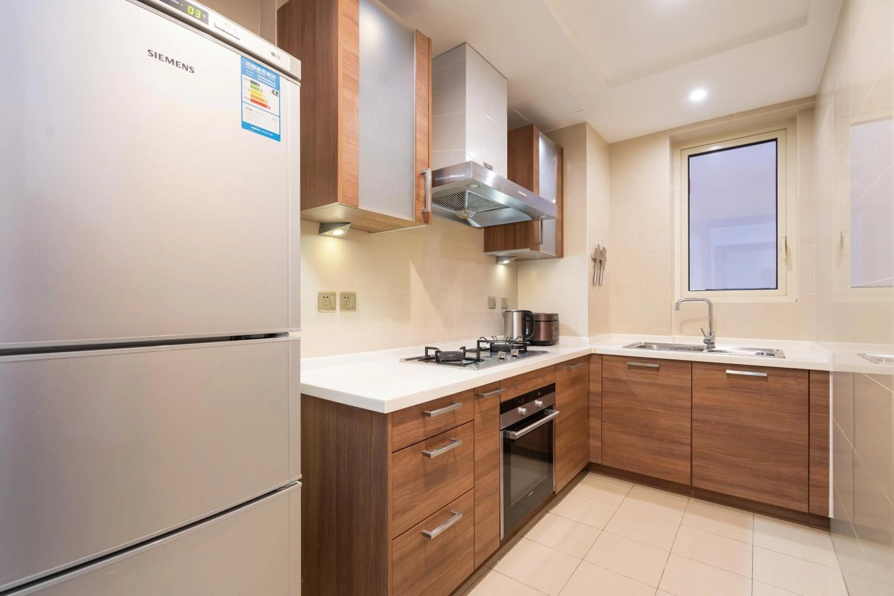 Kitchen or kitchenette in Sanya Yikehai View Apartments