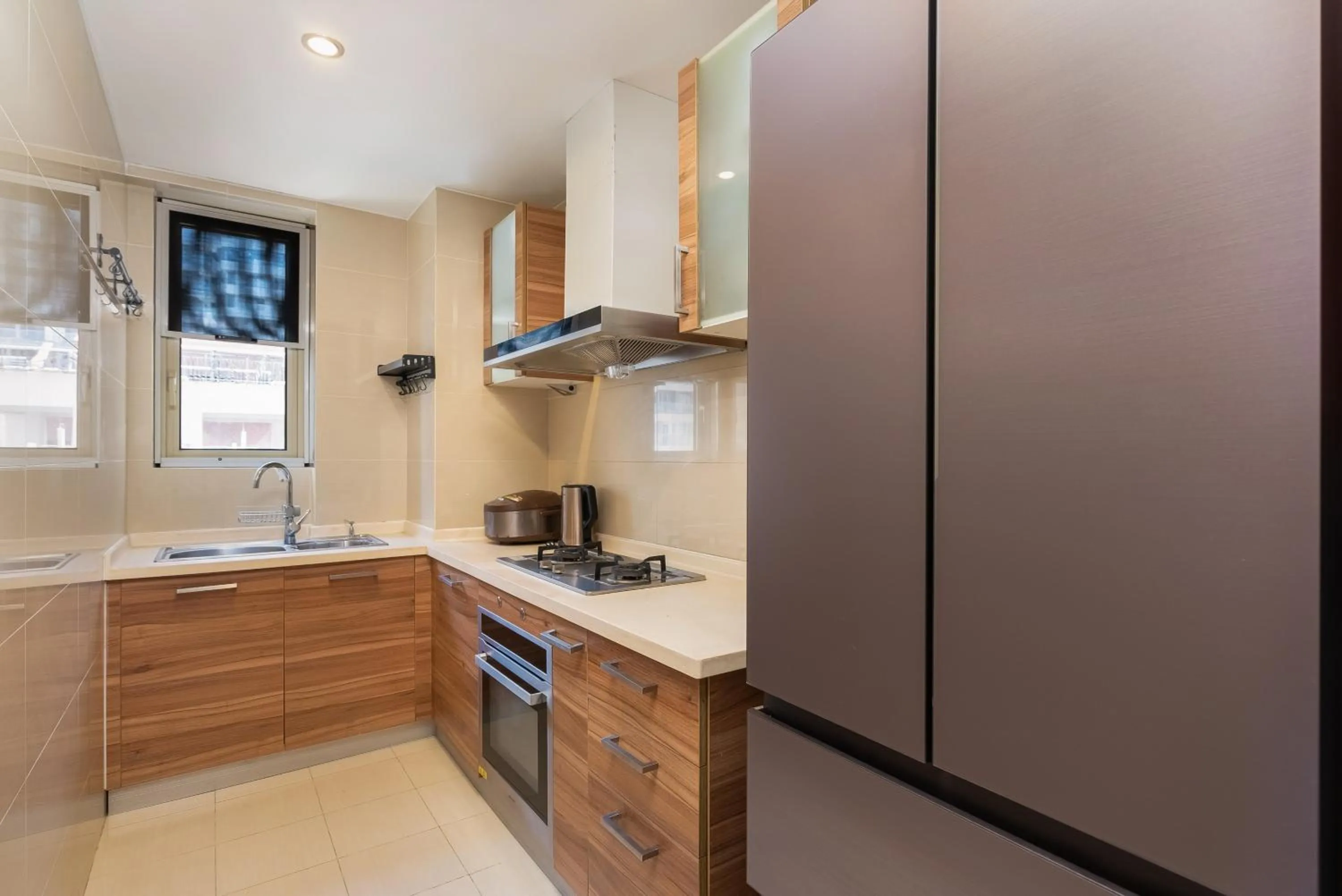 Kitchen or kitchenette in Sanya Yikehai View Apartments
