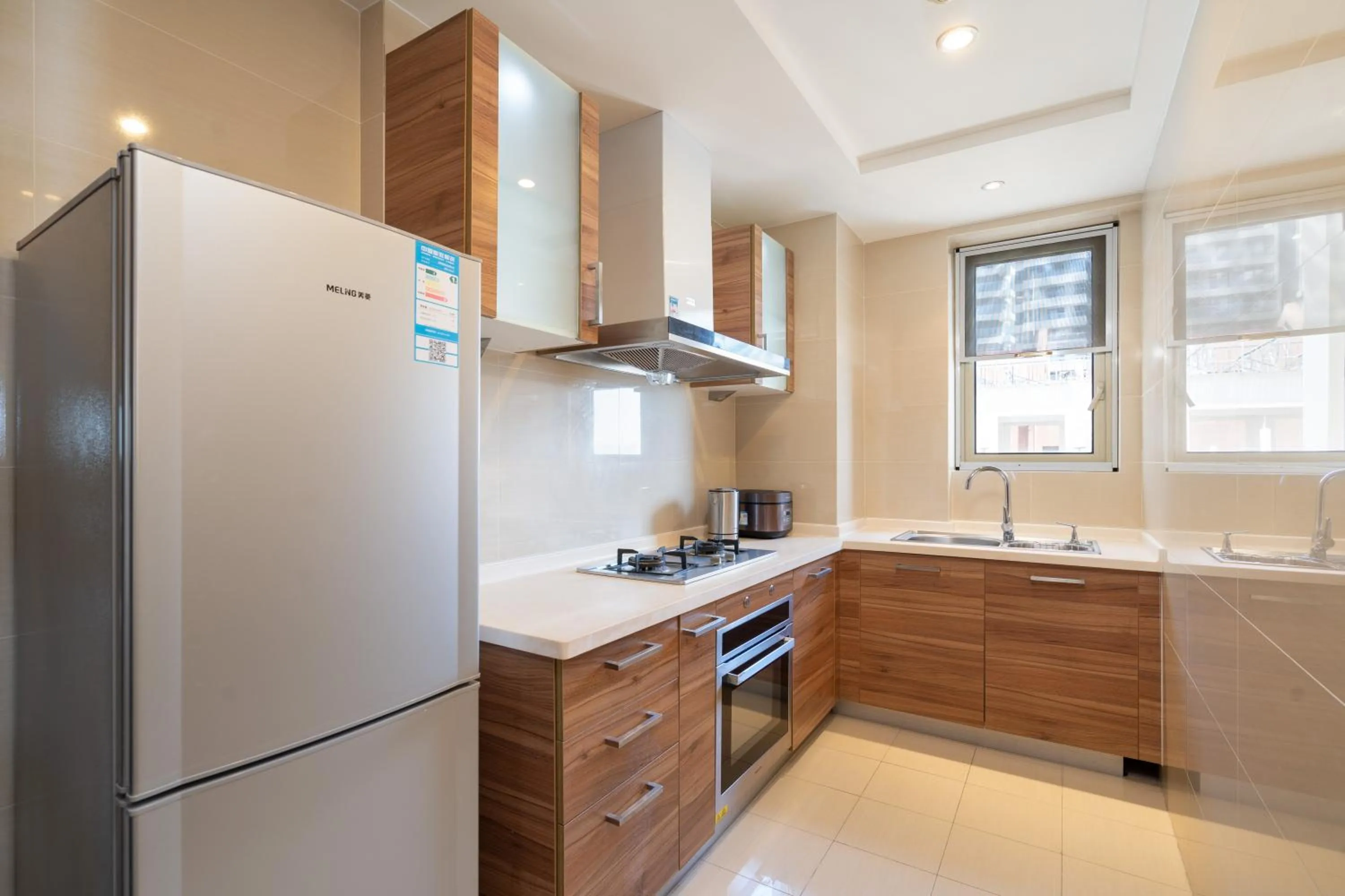 Kitchen or kitchenette in Sanya Yikehai View Apartments