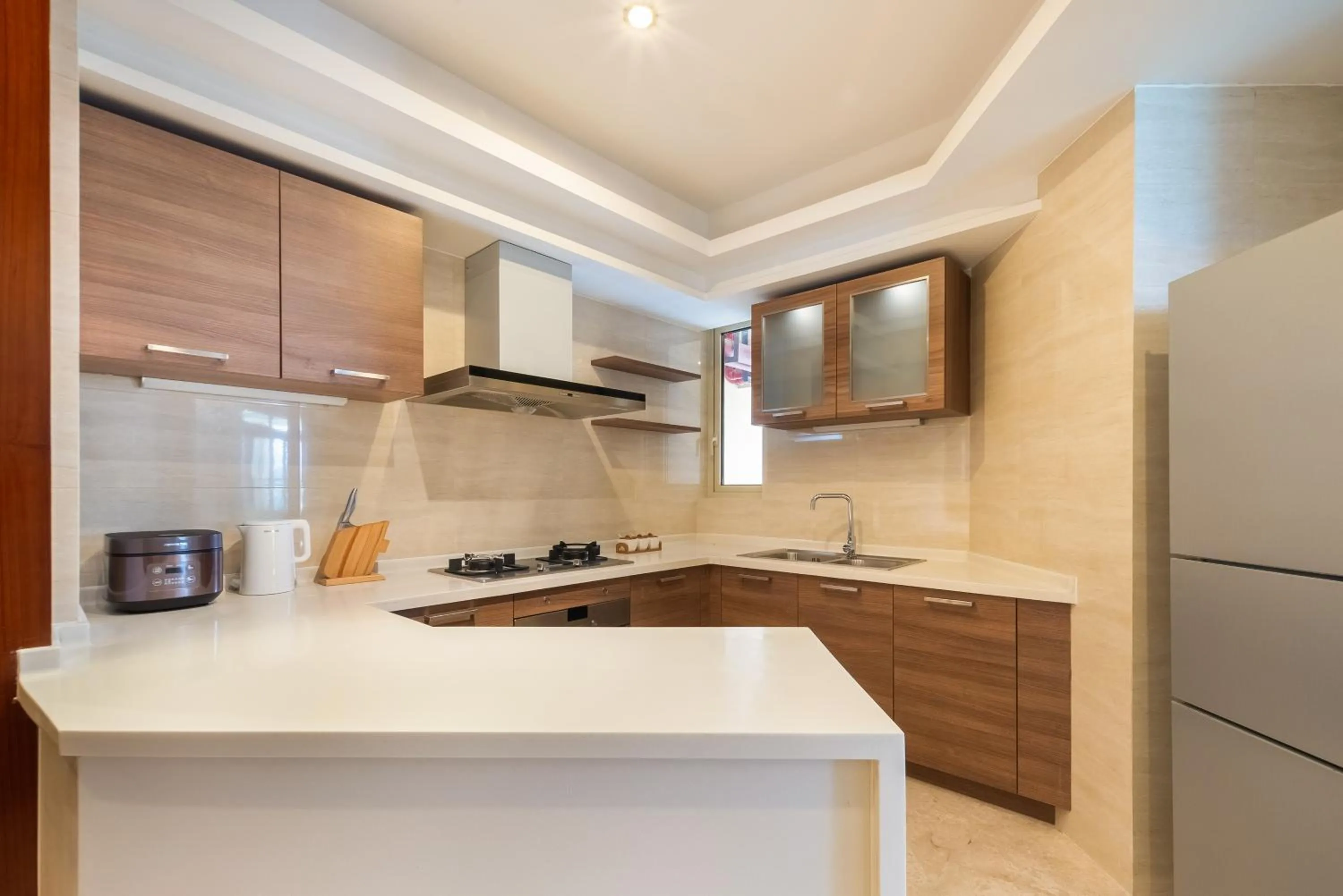 Kitchen or kitchenette in Sanya Yikehai View Apartments