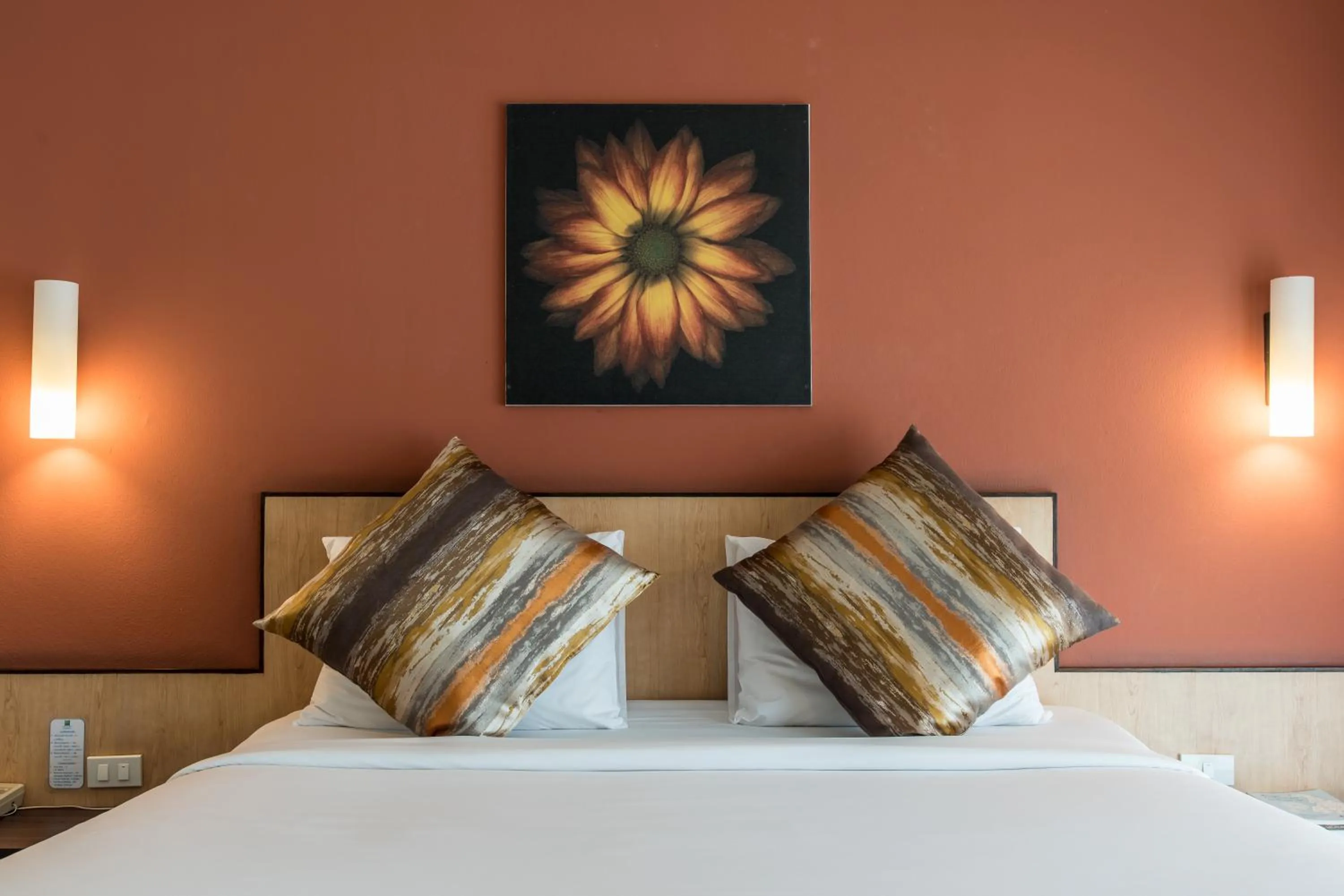 Bed in Chiangkhong Teak Garden Riverfront Onsen Hotel- SHA Extra Plus