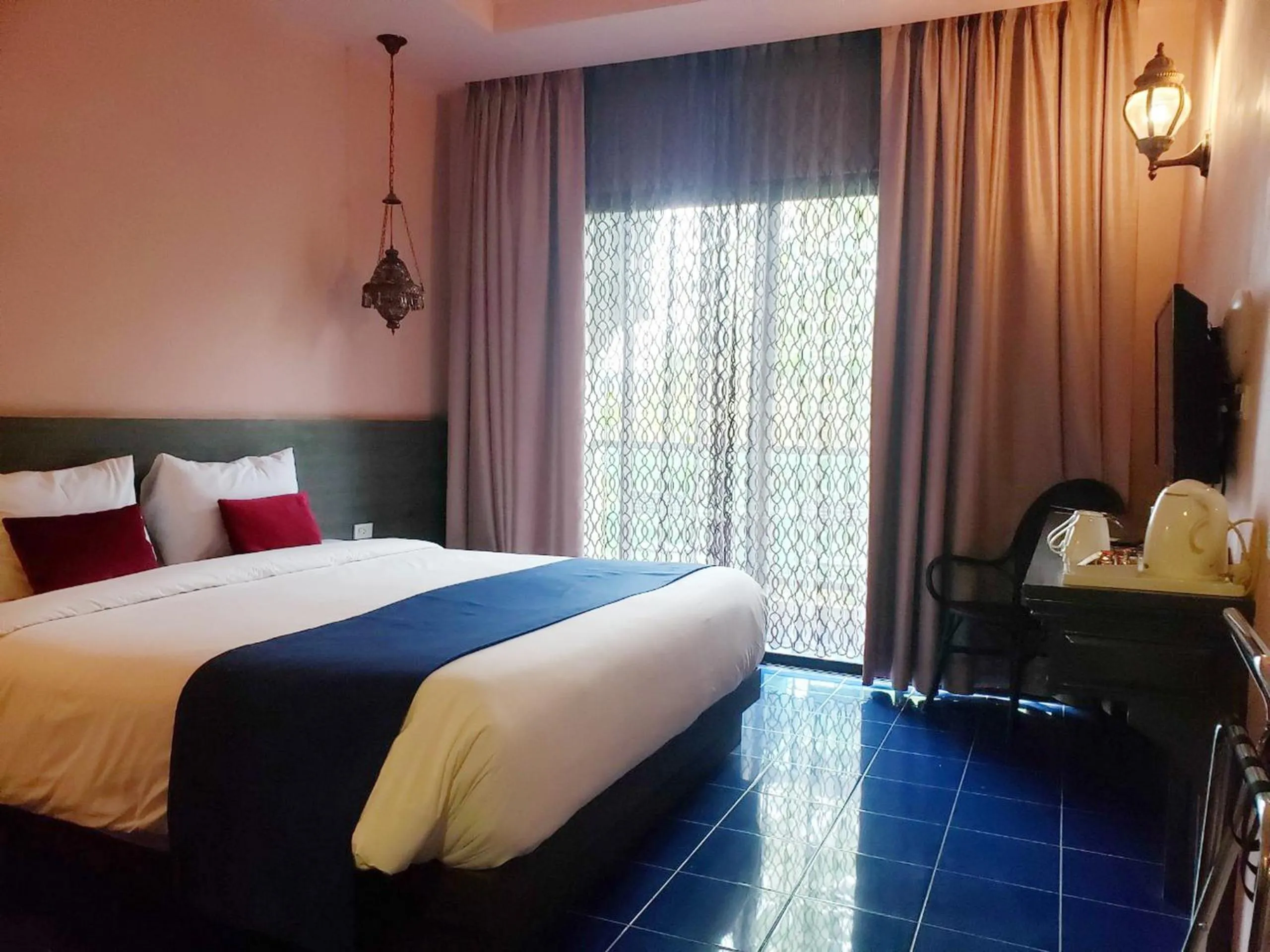 Bed in Chiangkhong Teak Garden Riverfront Onsen Hotel- SHA Extra Plus