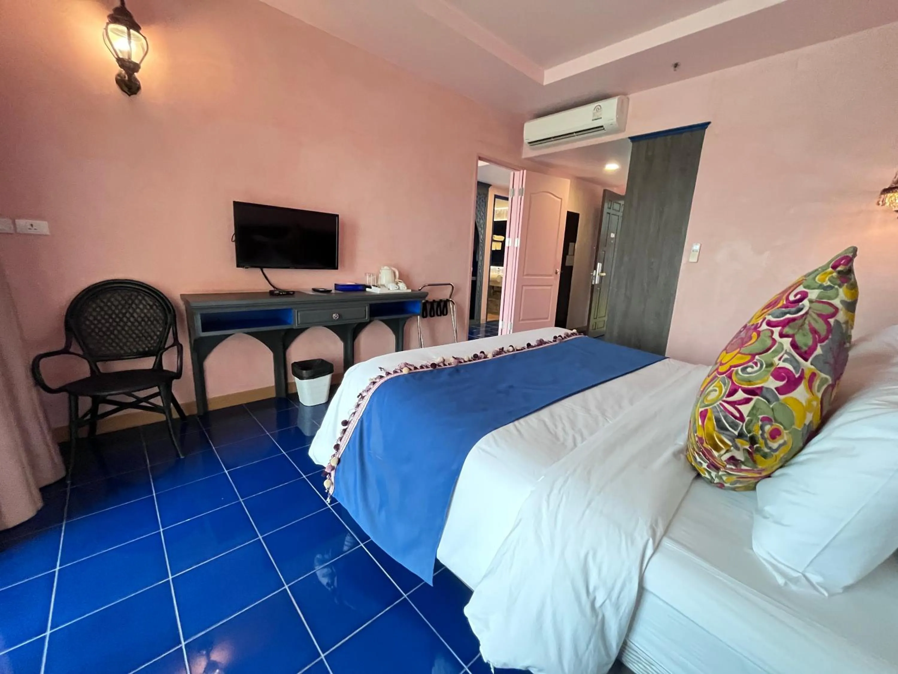 Bed in Chiangkhong Teak Garden Riverfront Onsen Hotel- SHA Extra Plus