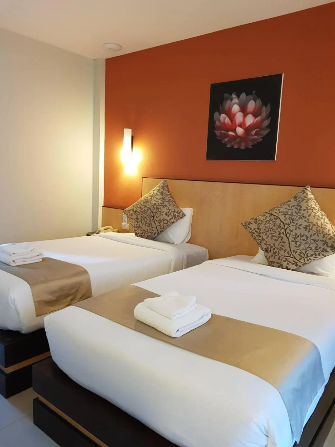 Bed in Chiangkhong Teak Garden Riverfront Onsen Hotel- SHA Extra Plus