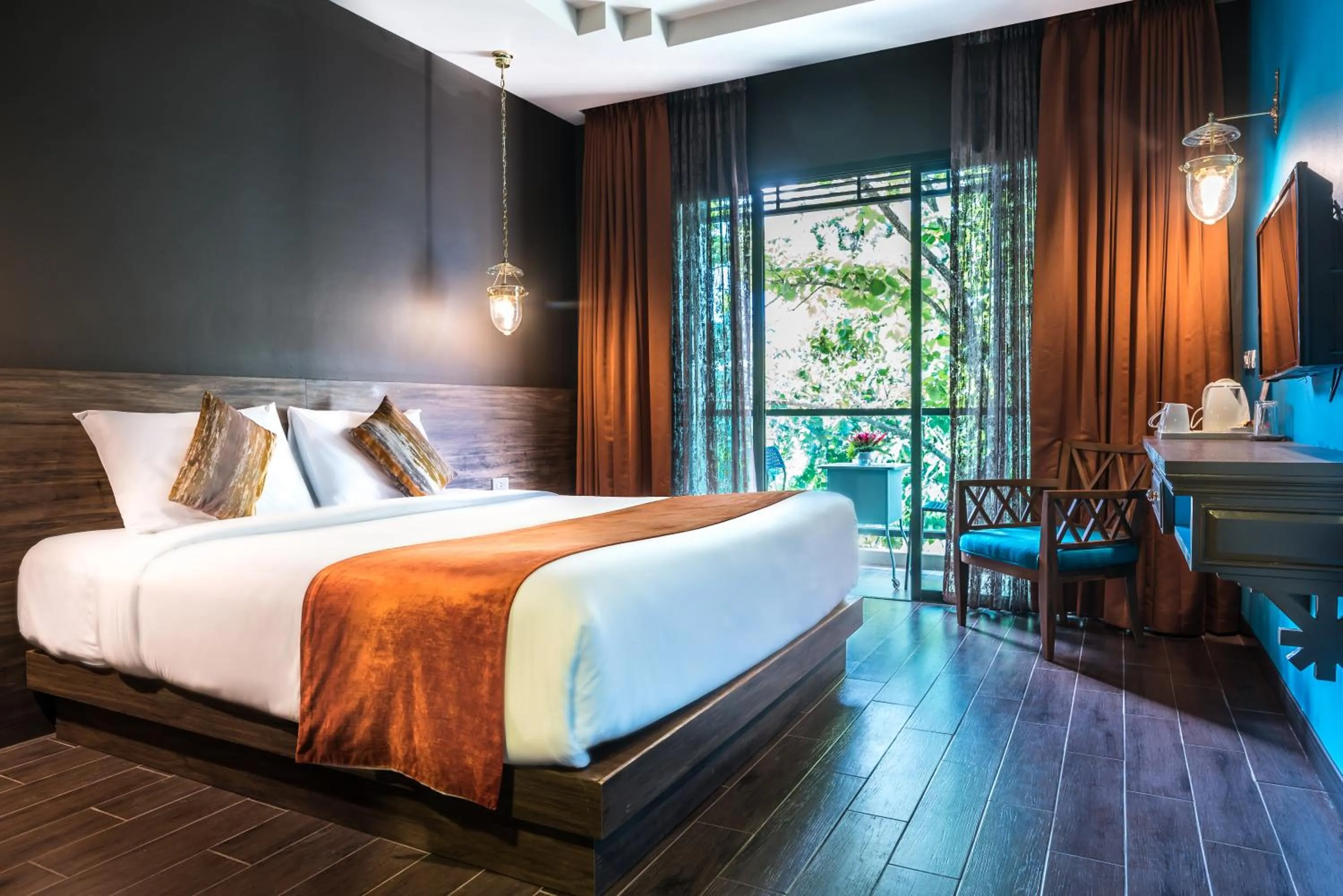 Photo of the whole room, Bed in Chiangkhong Teak Garden Riverfront Onsen Hotel- SHA Extra Plus