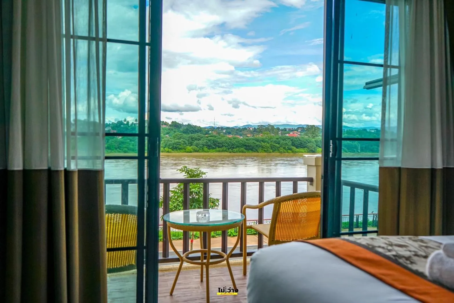 Bed in Chiangkhong Teak Garden Riverfront Onsen Hotel- SHA Extra Plus