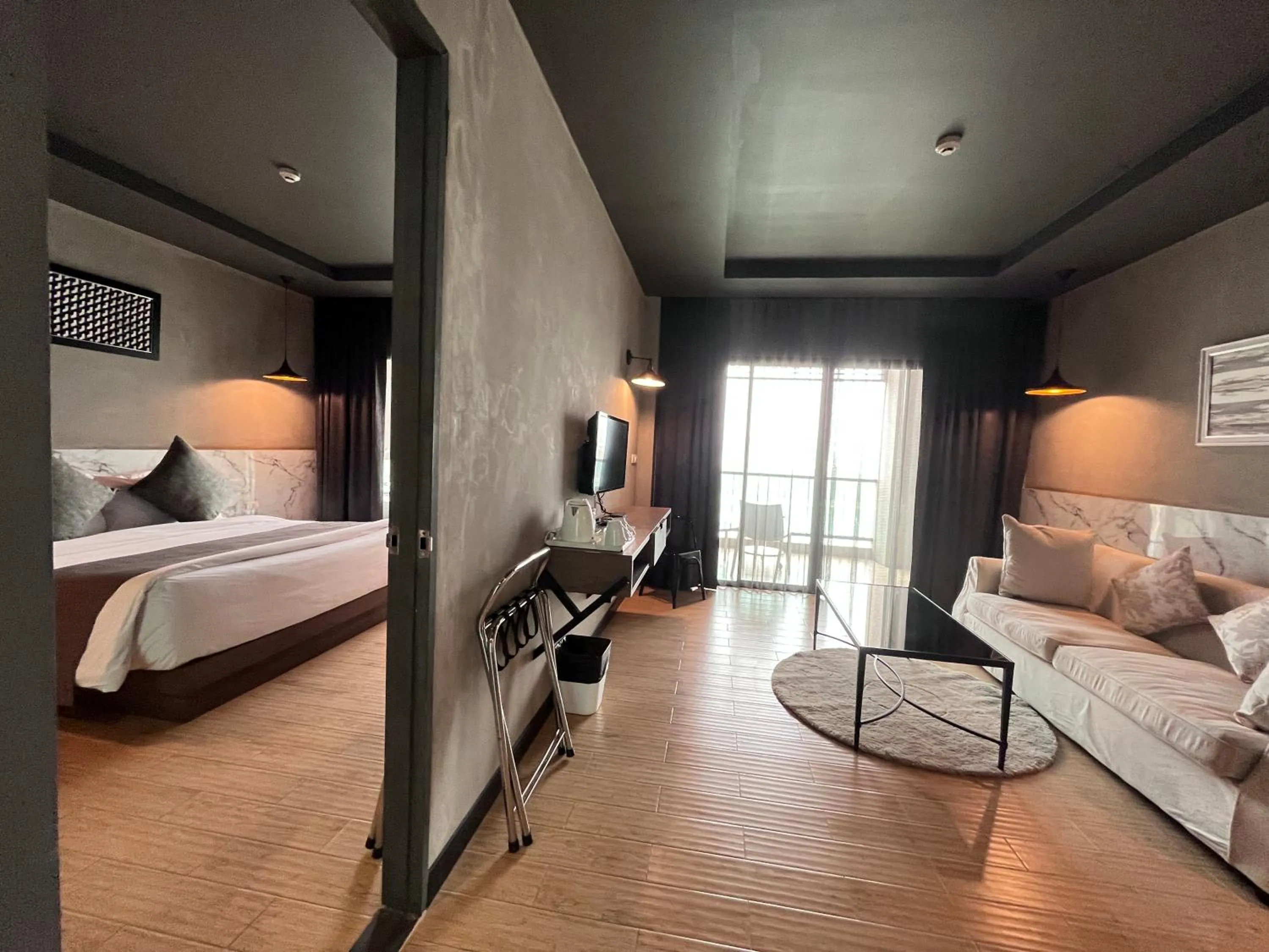 Bed in Chiangkhong Teak Garden Riverfront Onsen Hotel- SHA Extra Plus