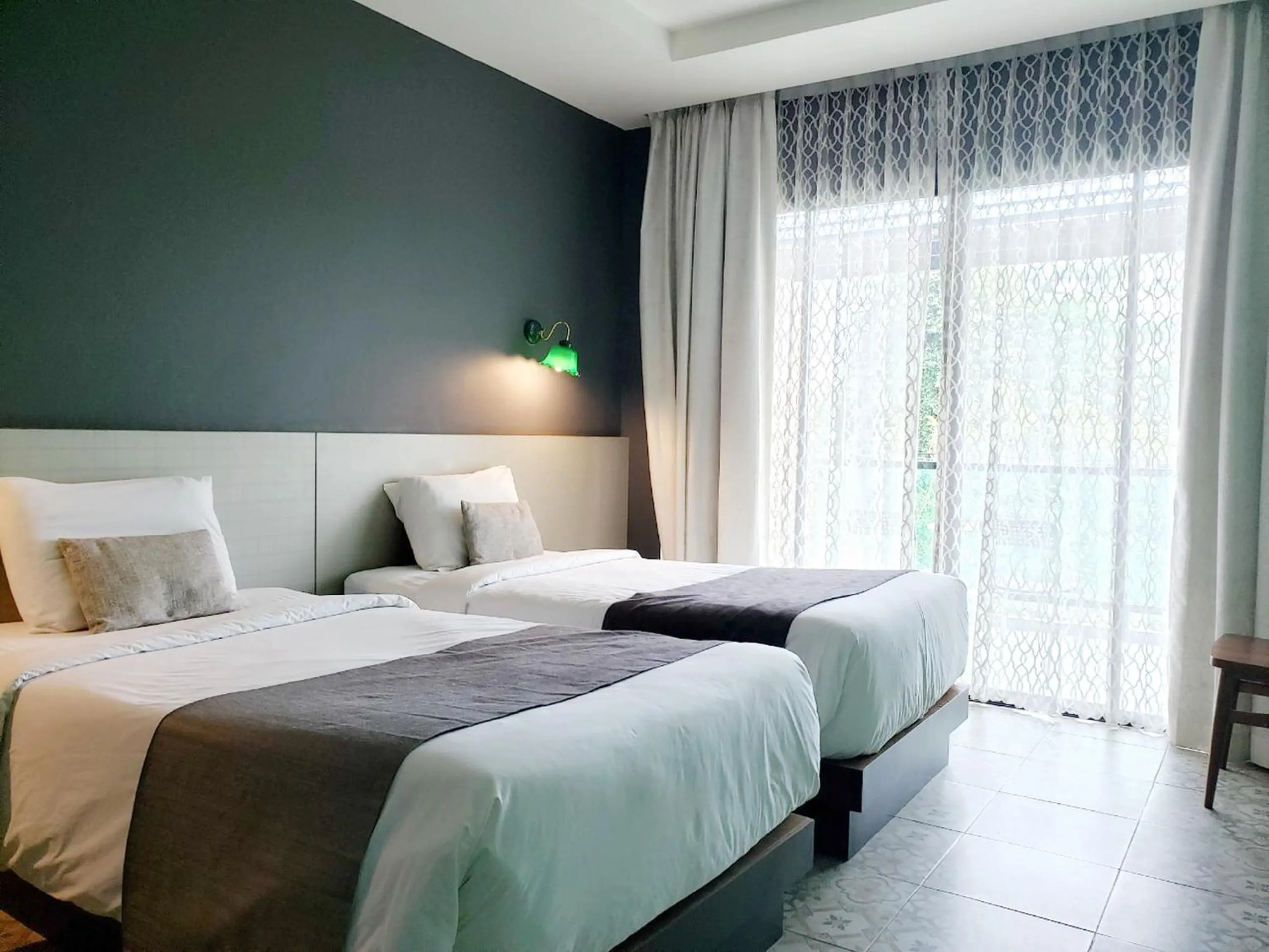 Bed in Chiangkhong Teak Garden Riverfront Onsen Hotel- SHA Extra Plus