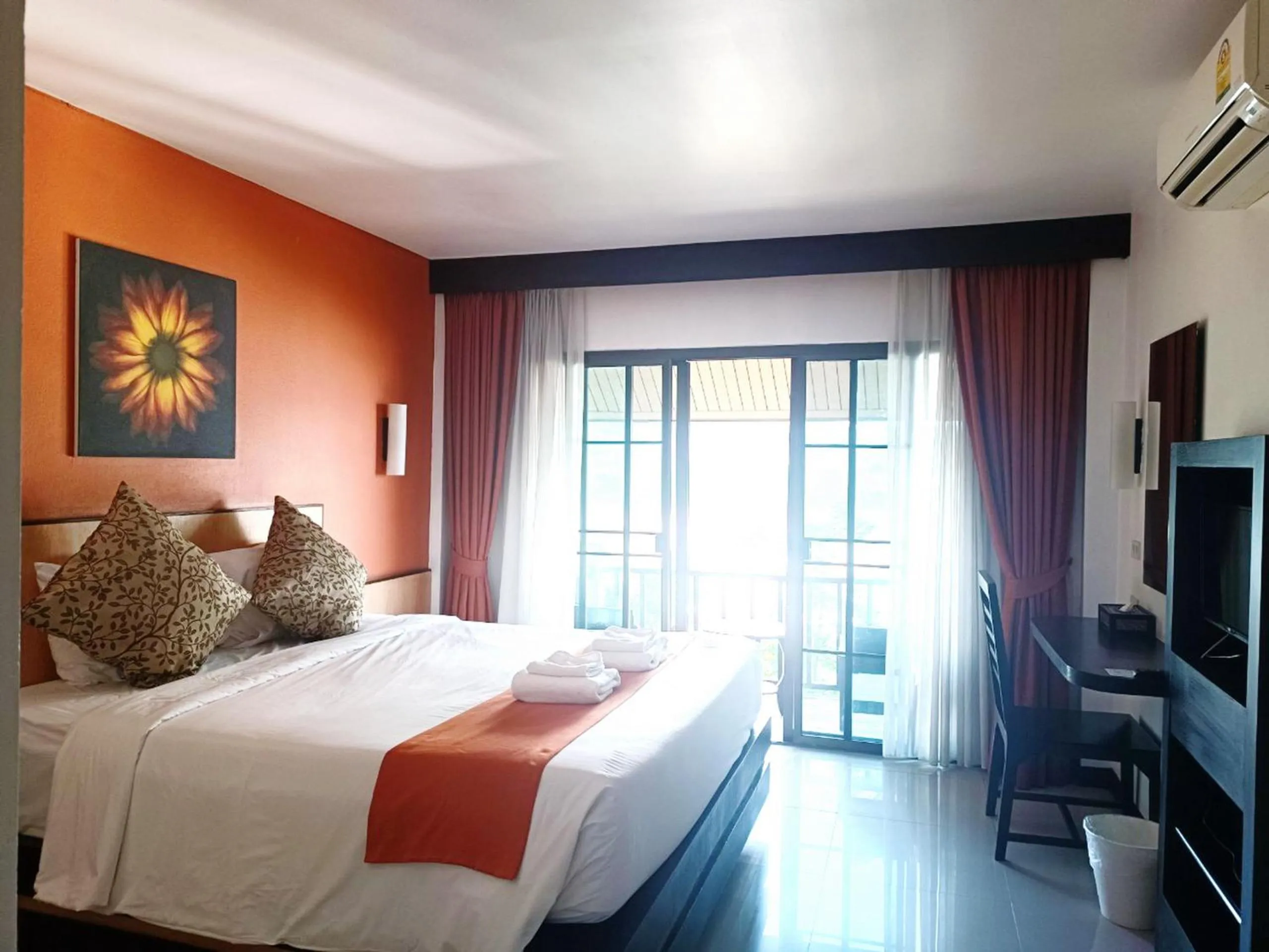 Bed in Chiangkhong Teak Garden Riverfront Onsen Hotel- SHA Extra Plus