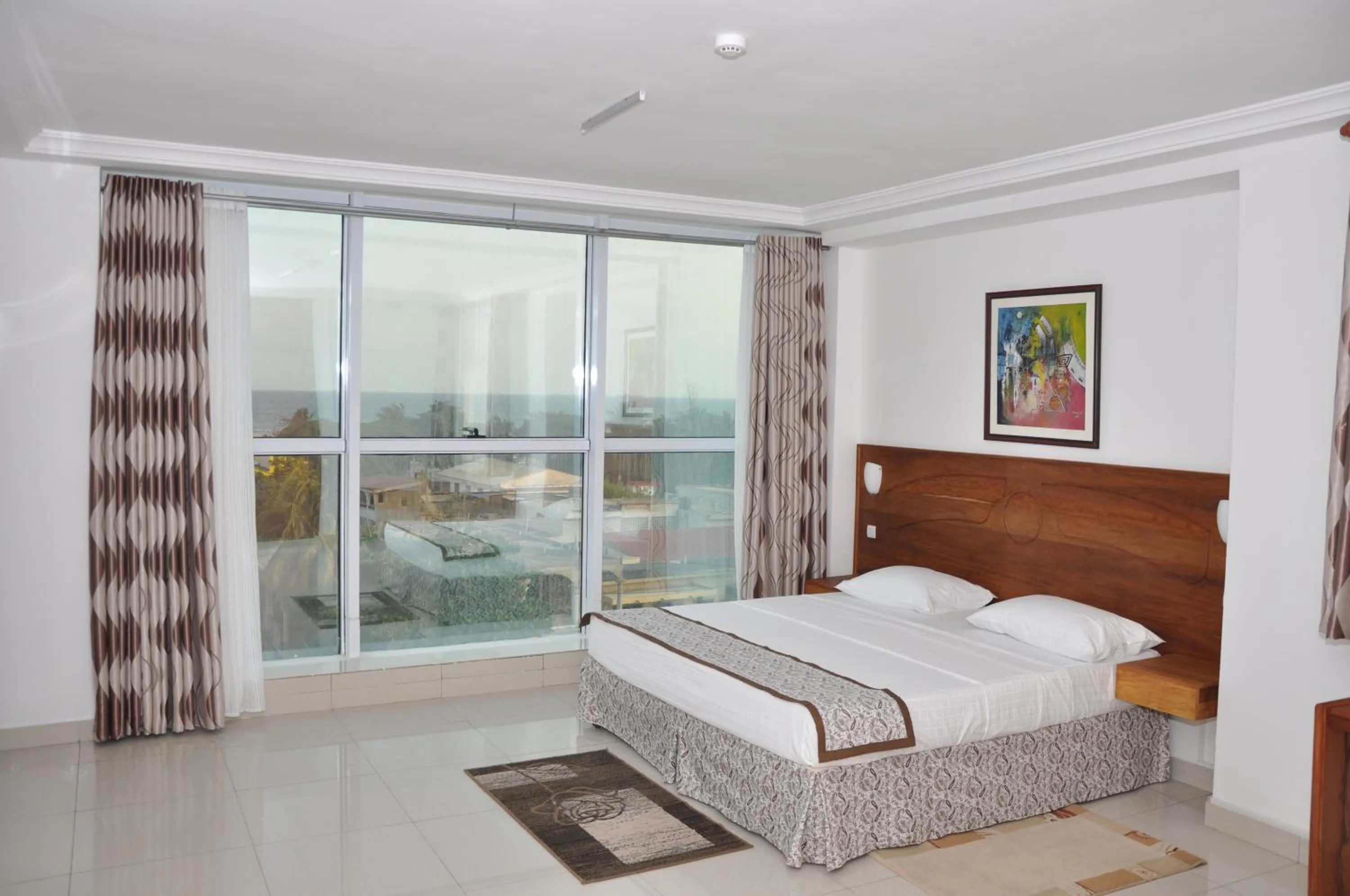 Bed in Rosalie's Suites