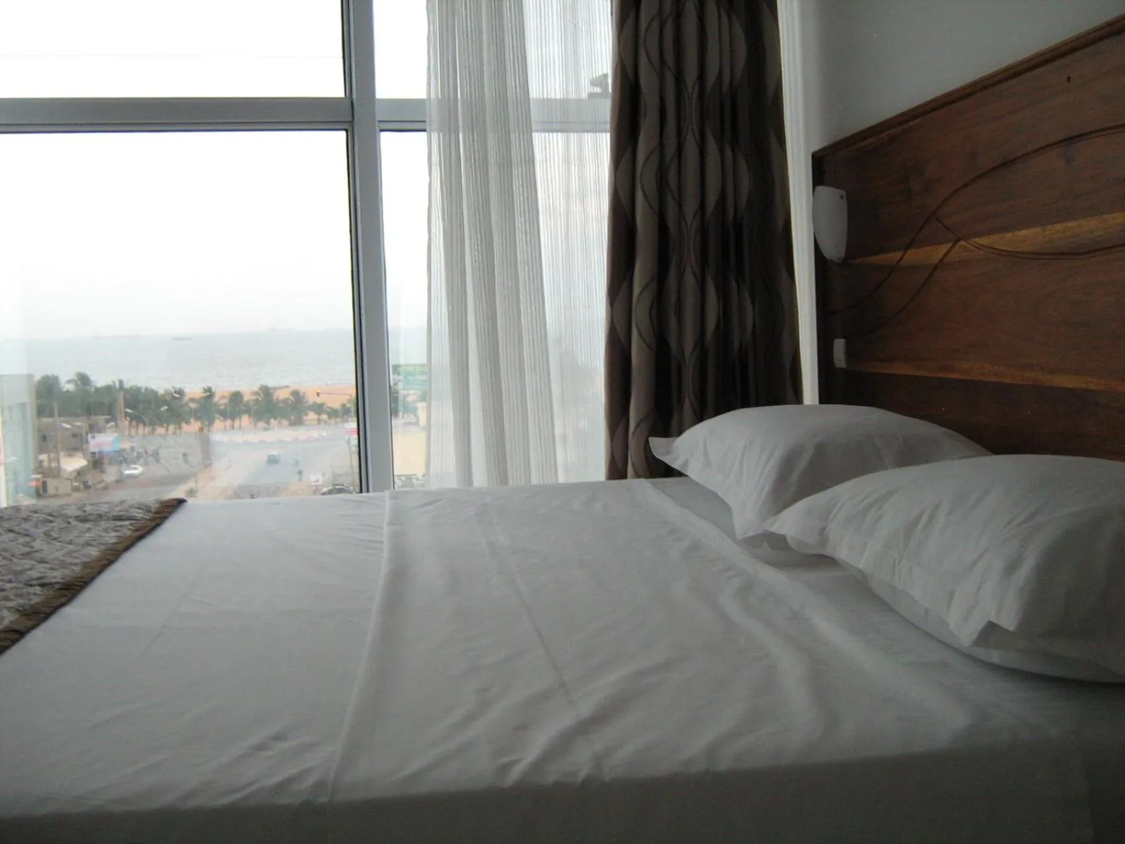 Bed in Rosalie's Suites