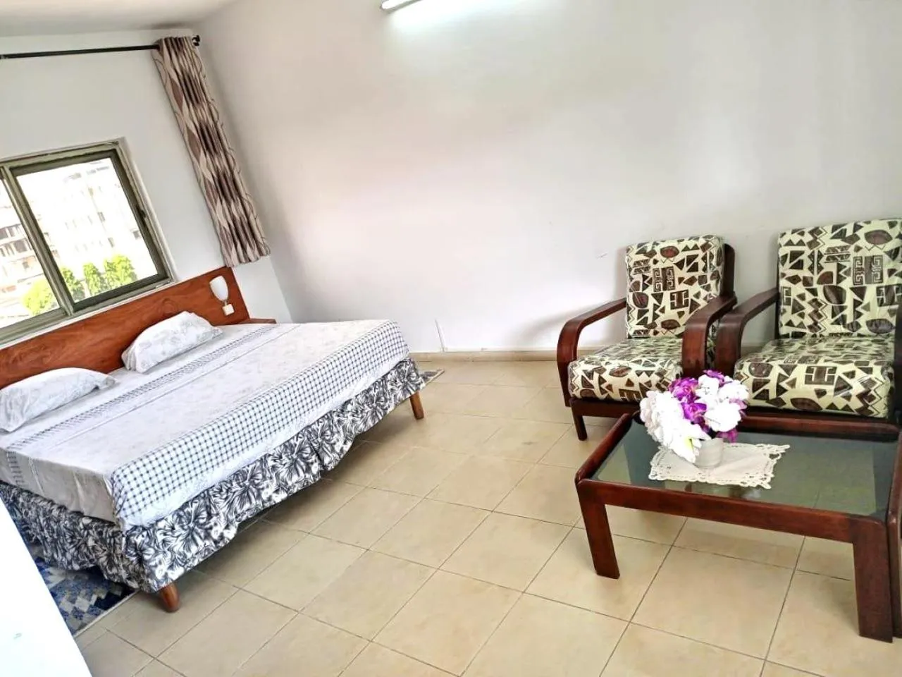 Bed in Rosalie's Suites