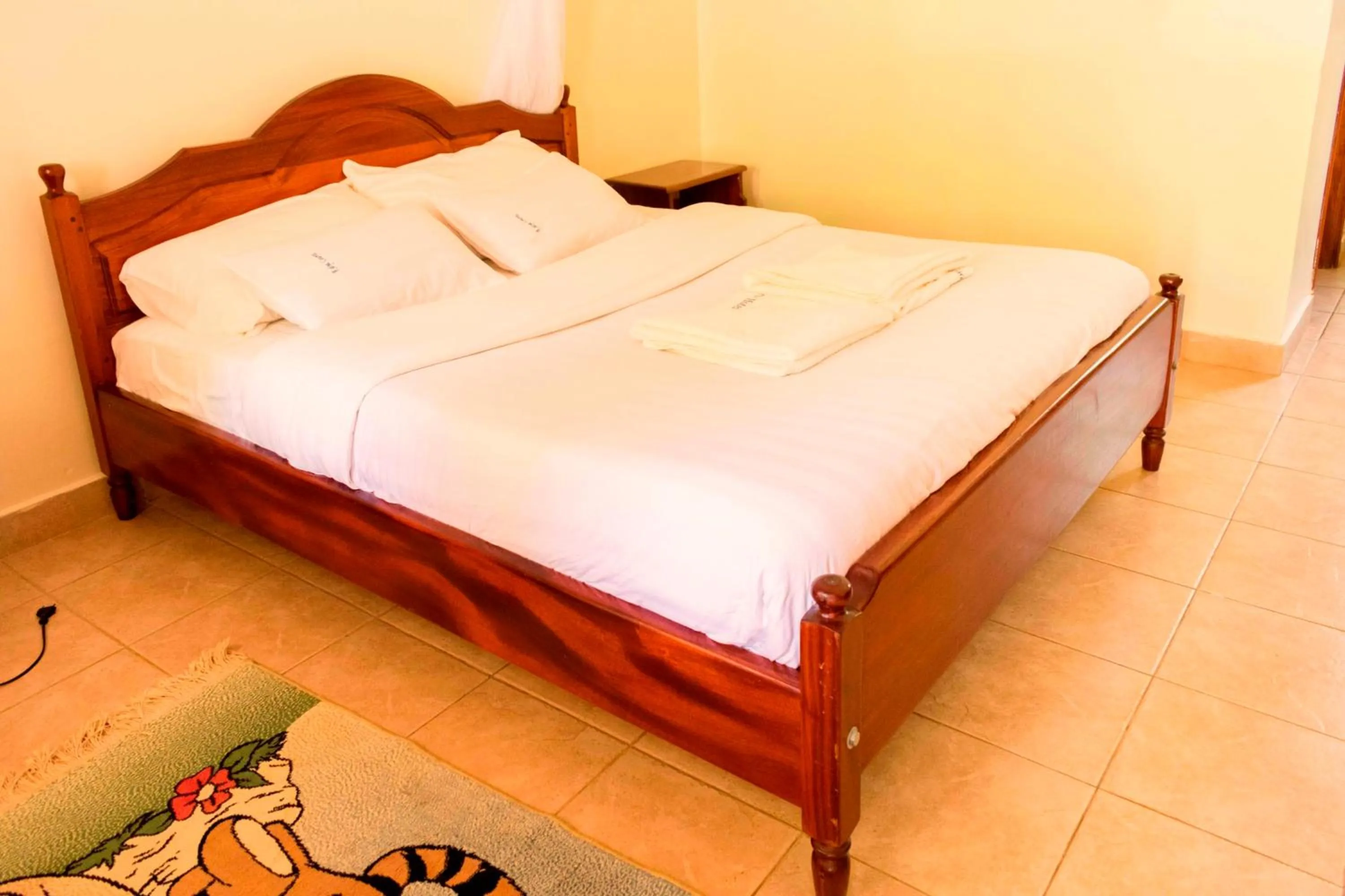 Bed in Kalya Courts Hotel Fort Portal