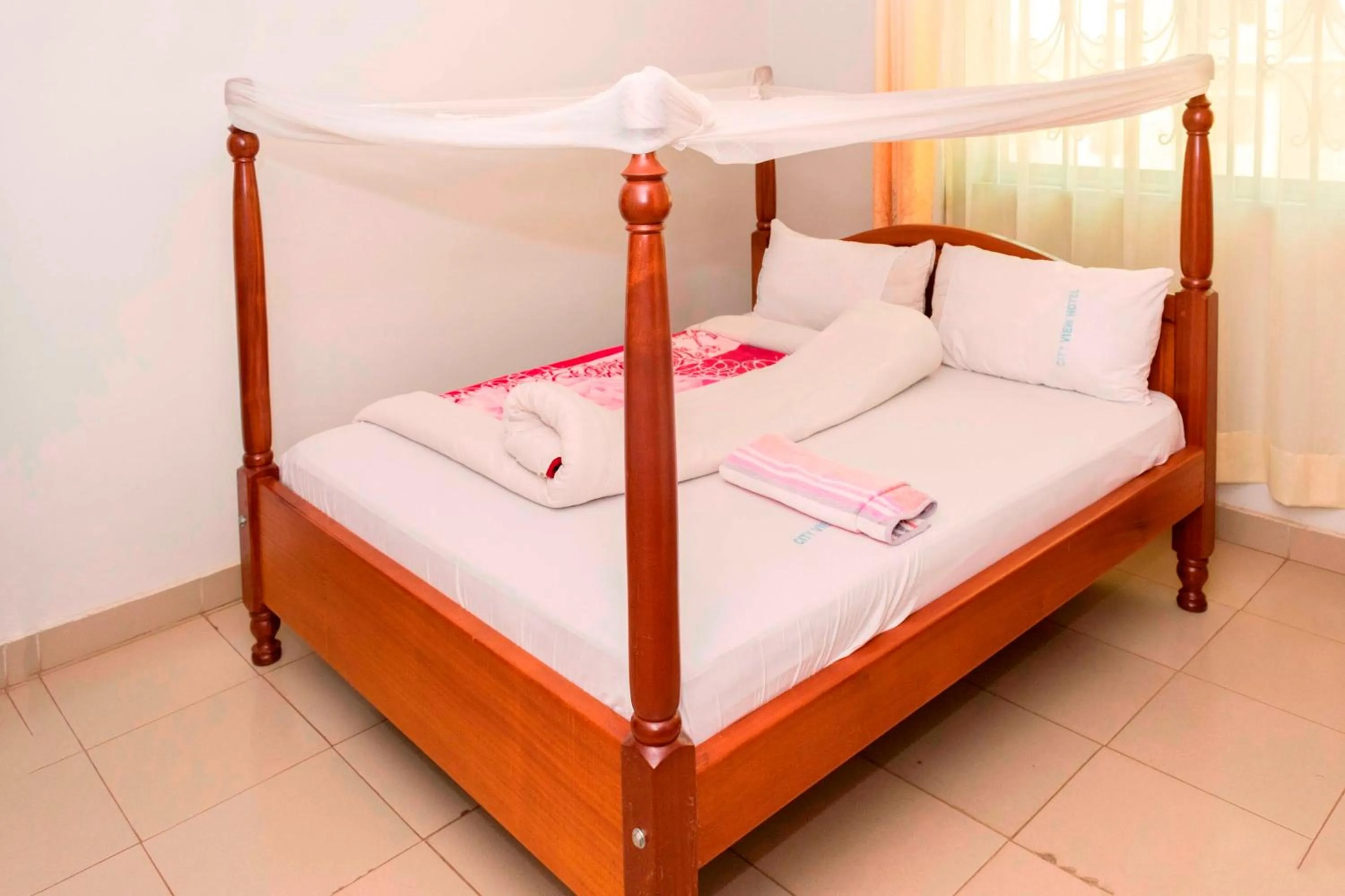 Bed in Kalya Courts Hotel Fort Portal