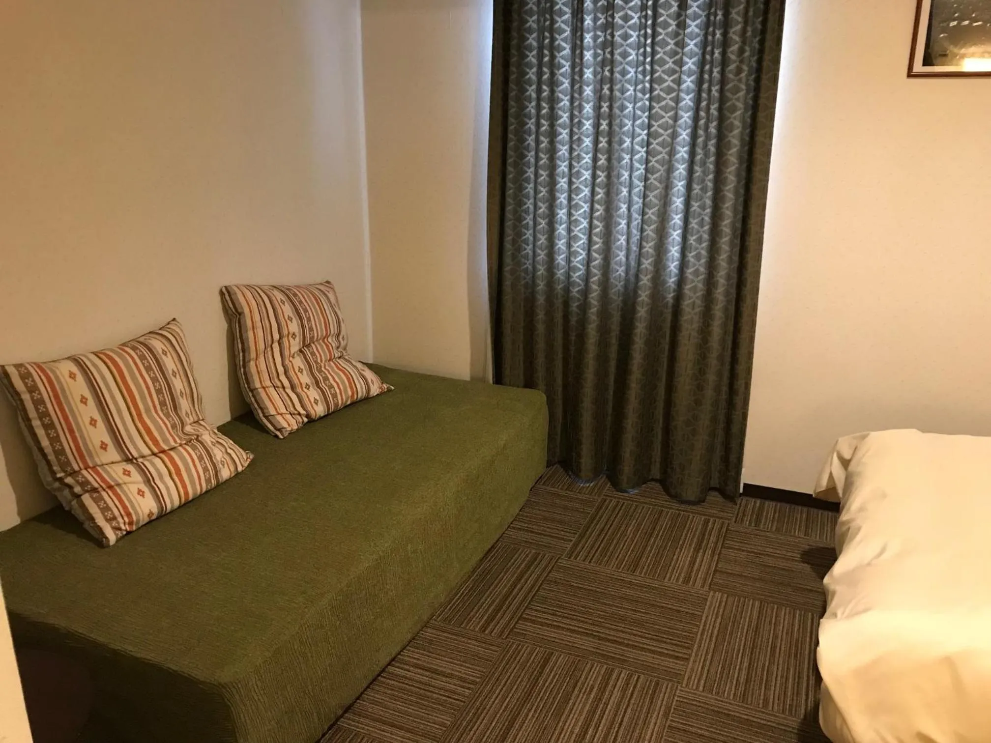 Photo of the whole room, Bed in Hotel Crown Hills Nakamura