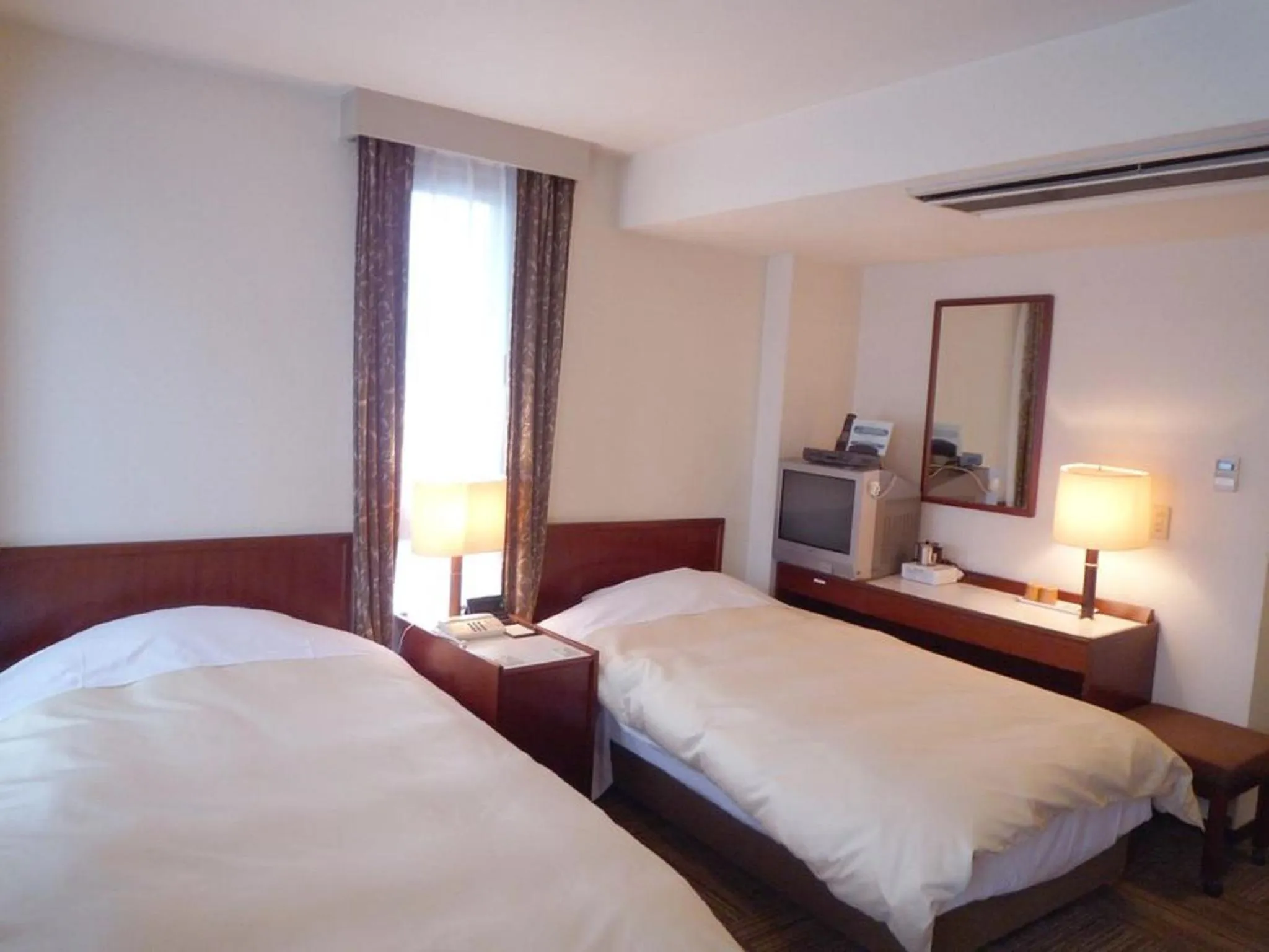 Bedroom, Bed in Hotel Crown Hills Nakamura