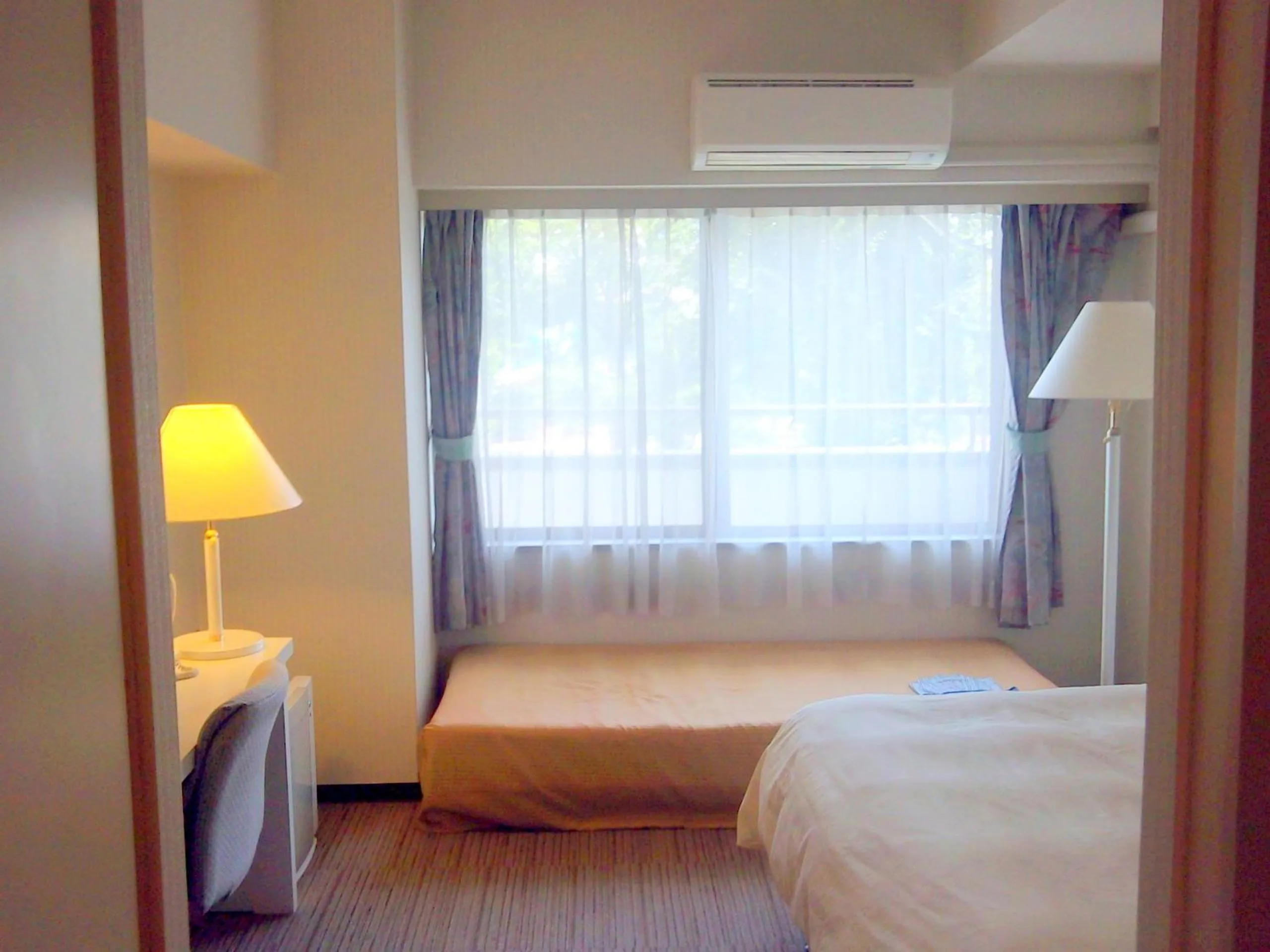 Photo of the whole room, Bed in Okaya Central Hotel