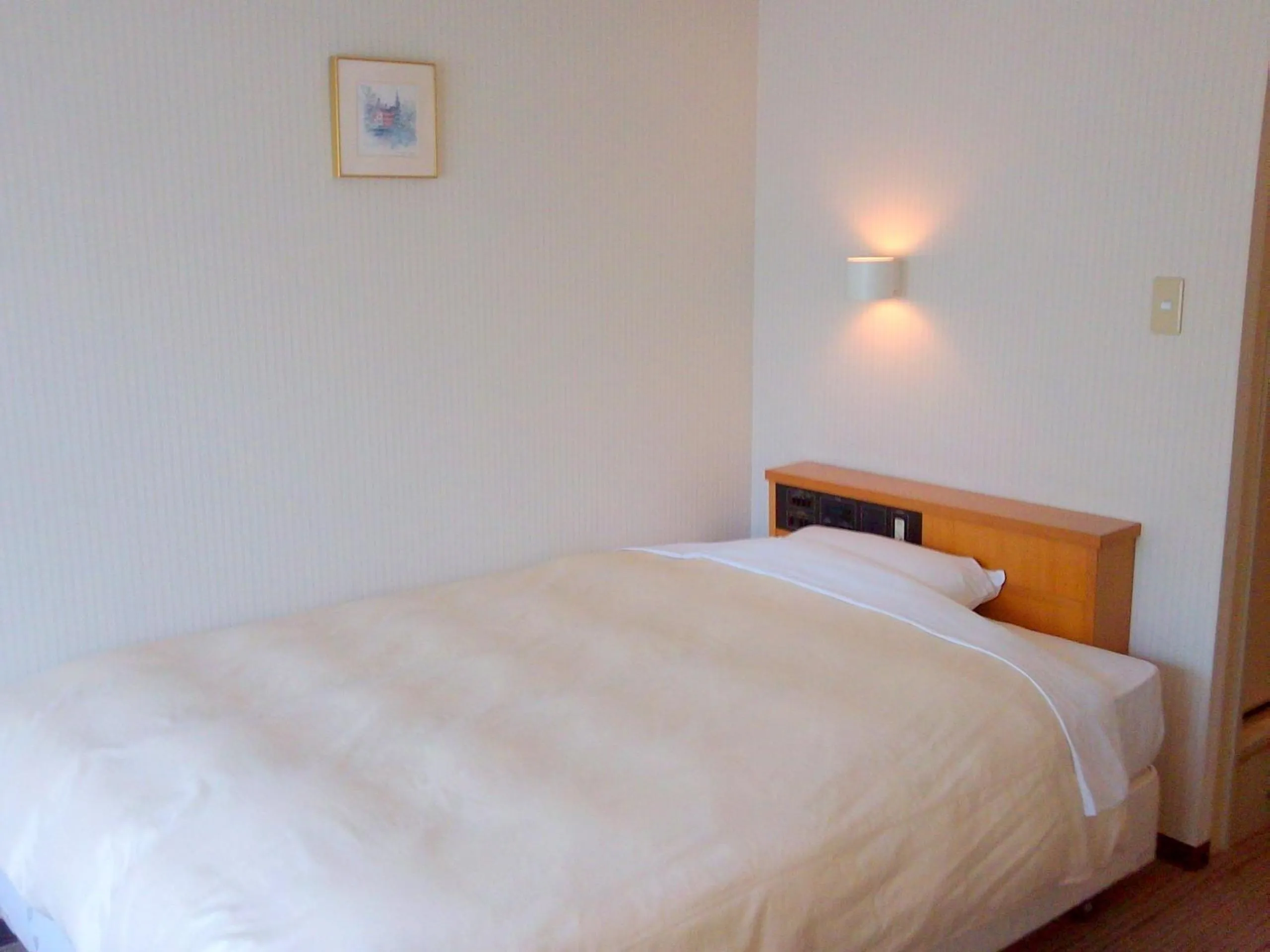 Bed in Okaya Central Hotel