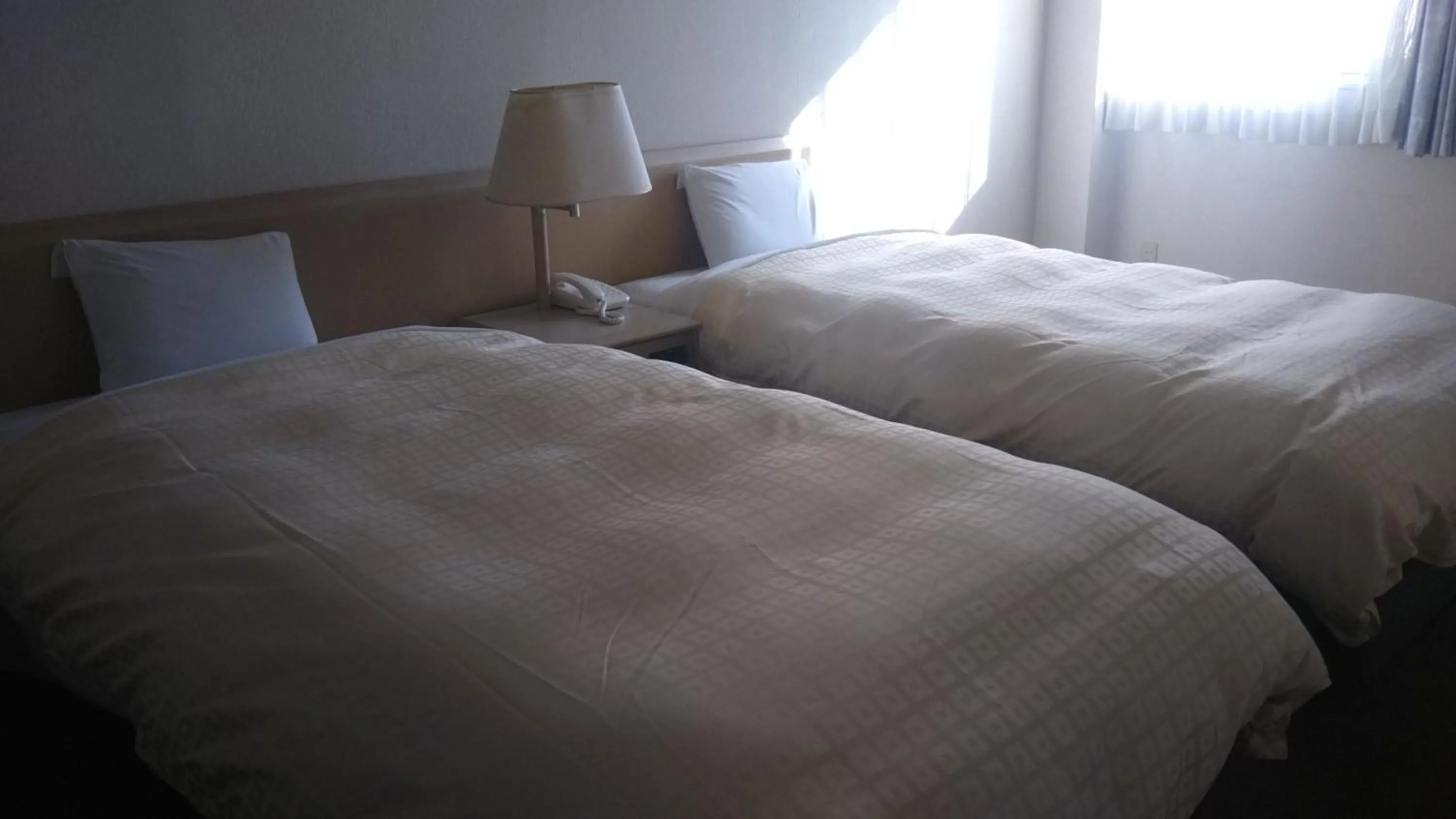Bed in Hotel Hitachi Hills