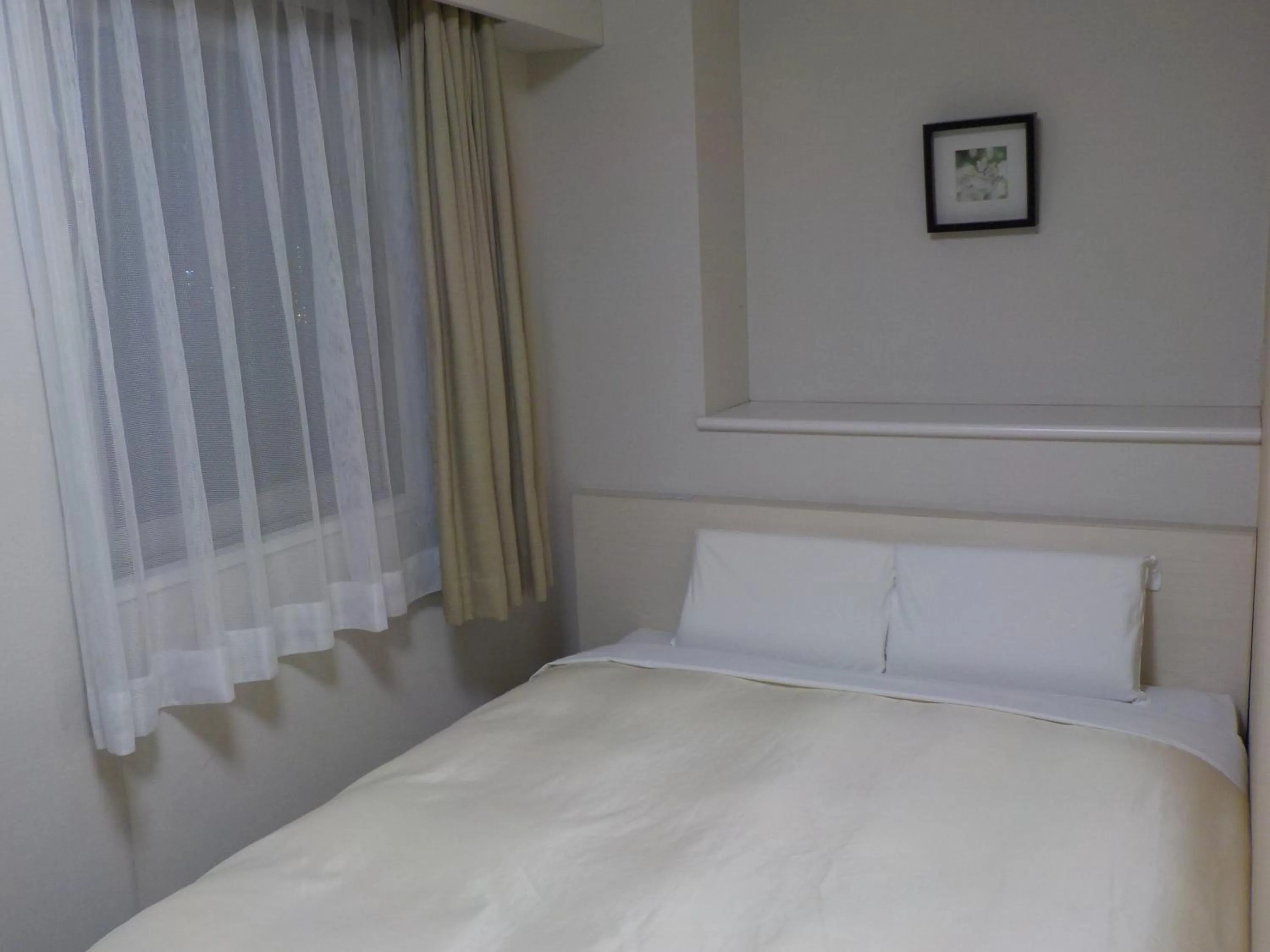 Bed in Hotel Crown Hills Katsuta Omotechoten