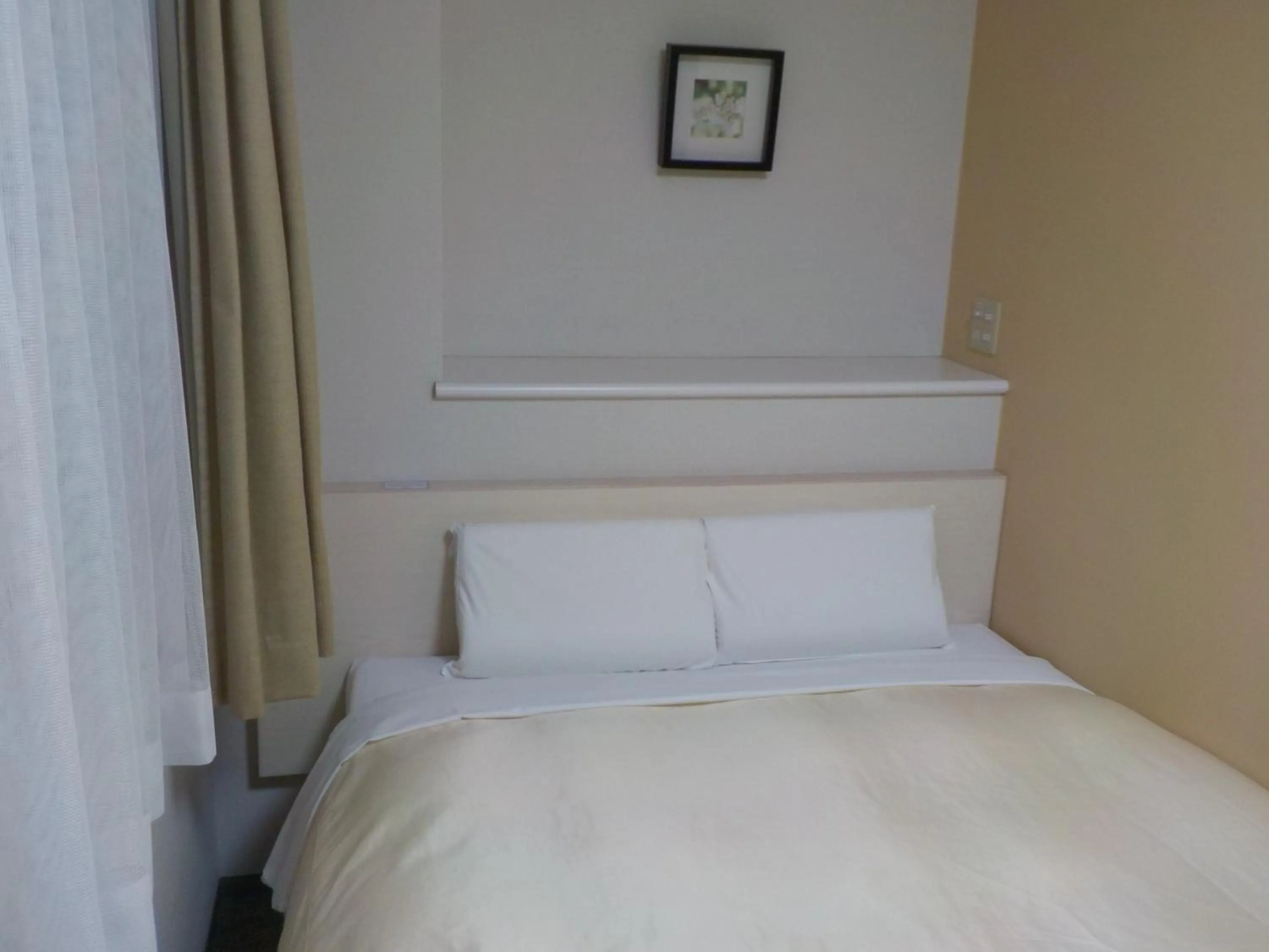 Bed in Hotel Crown Hills Katsuta Omotechoten