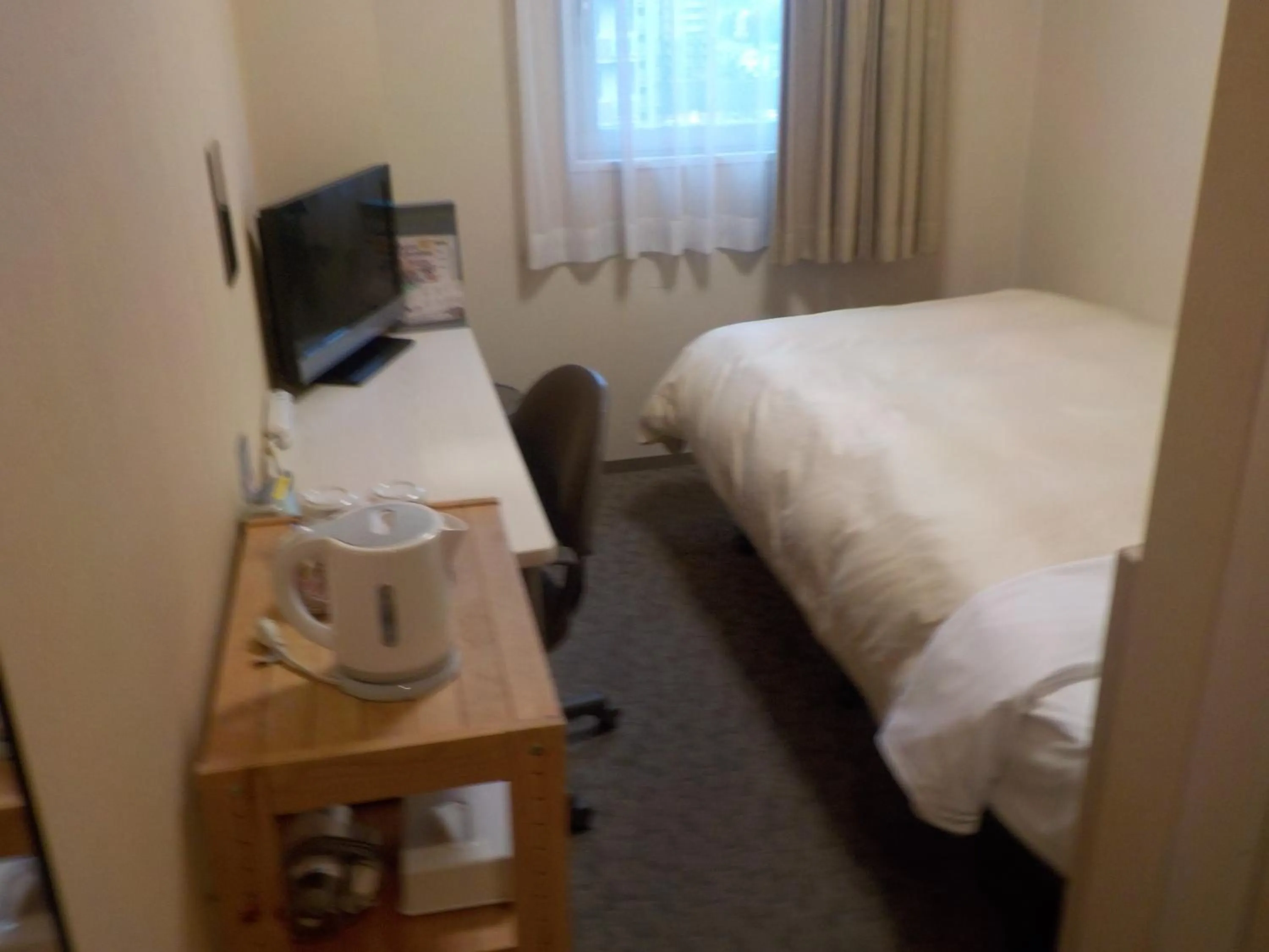 Photo of the whole room, Bed in Hotel Crown Hills Katsuta Omotechoten