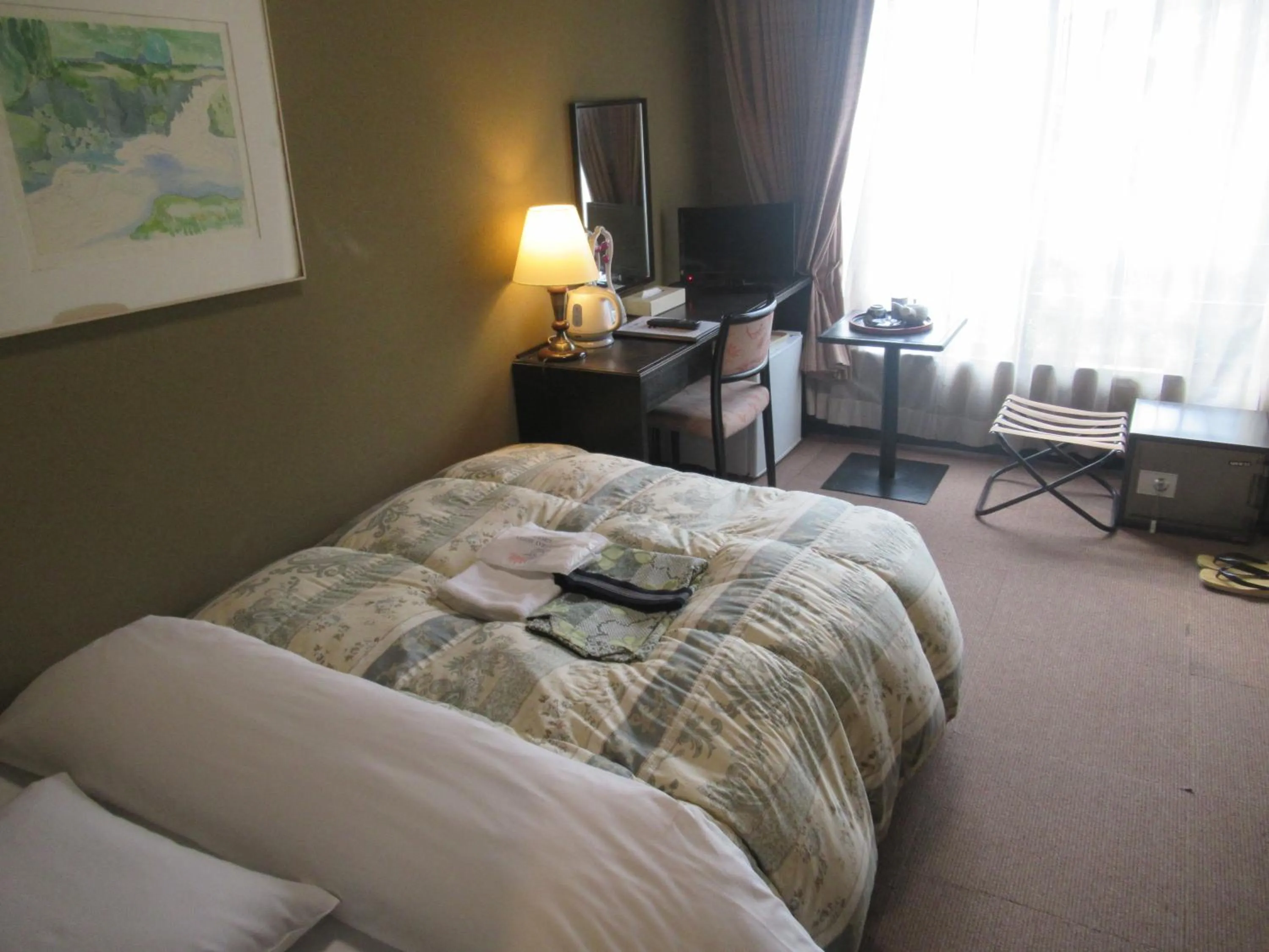 Photo of the whole room, Bed in Kikuchi Kanko Hotel