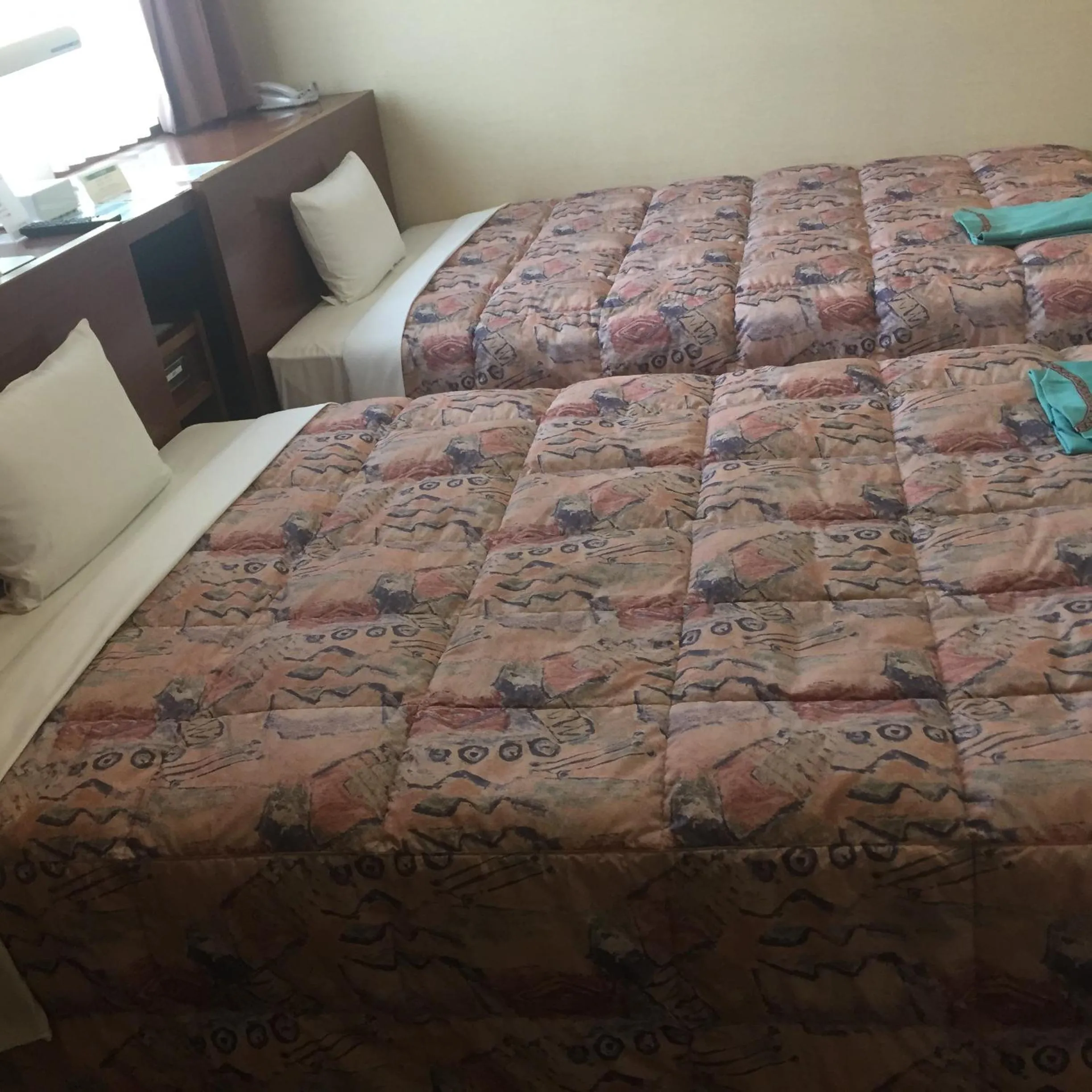 Bed in Hotel Niihama Hills