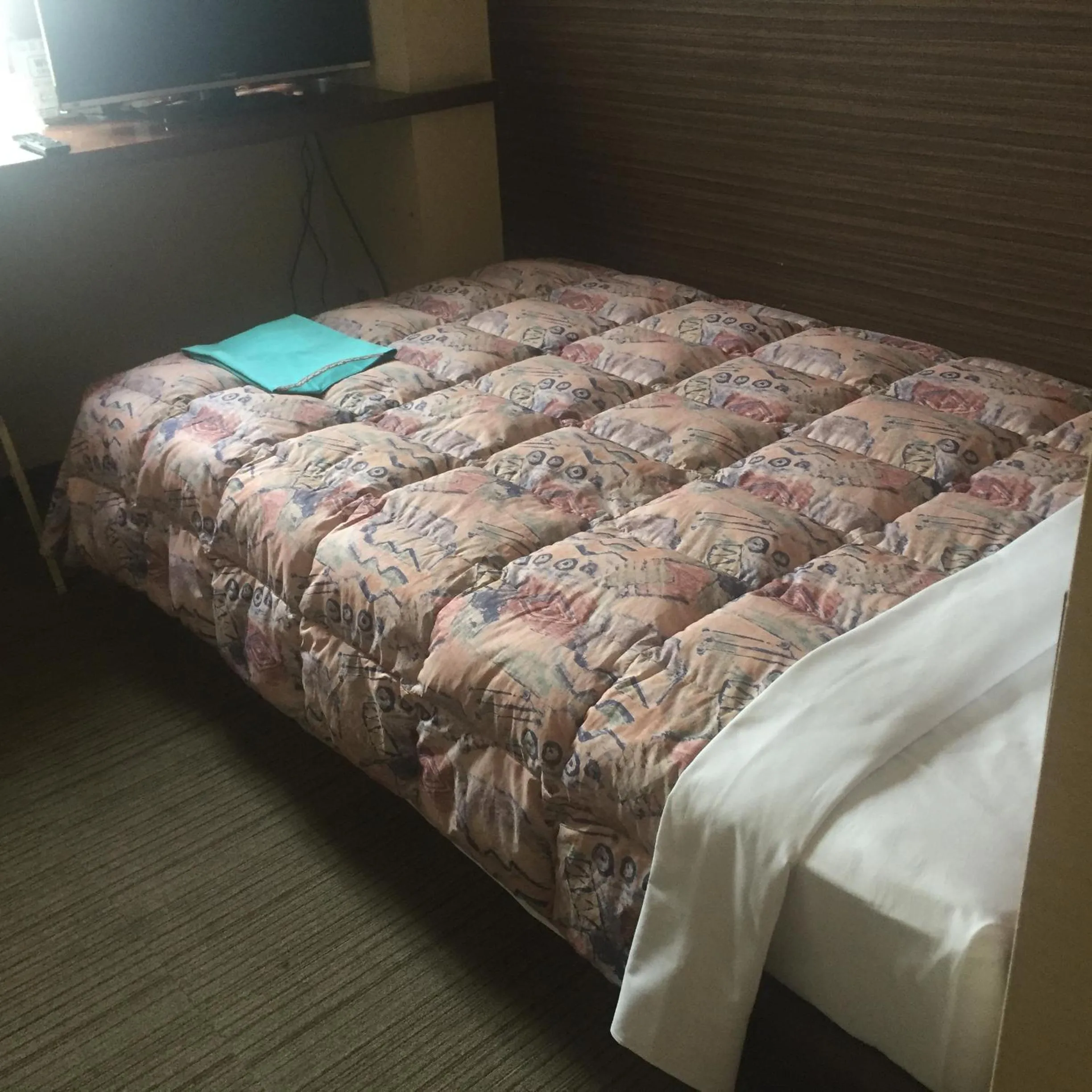 Bed in Hotel Niihama Hills