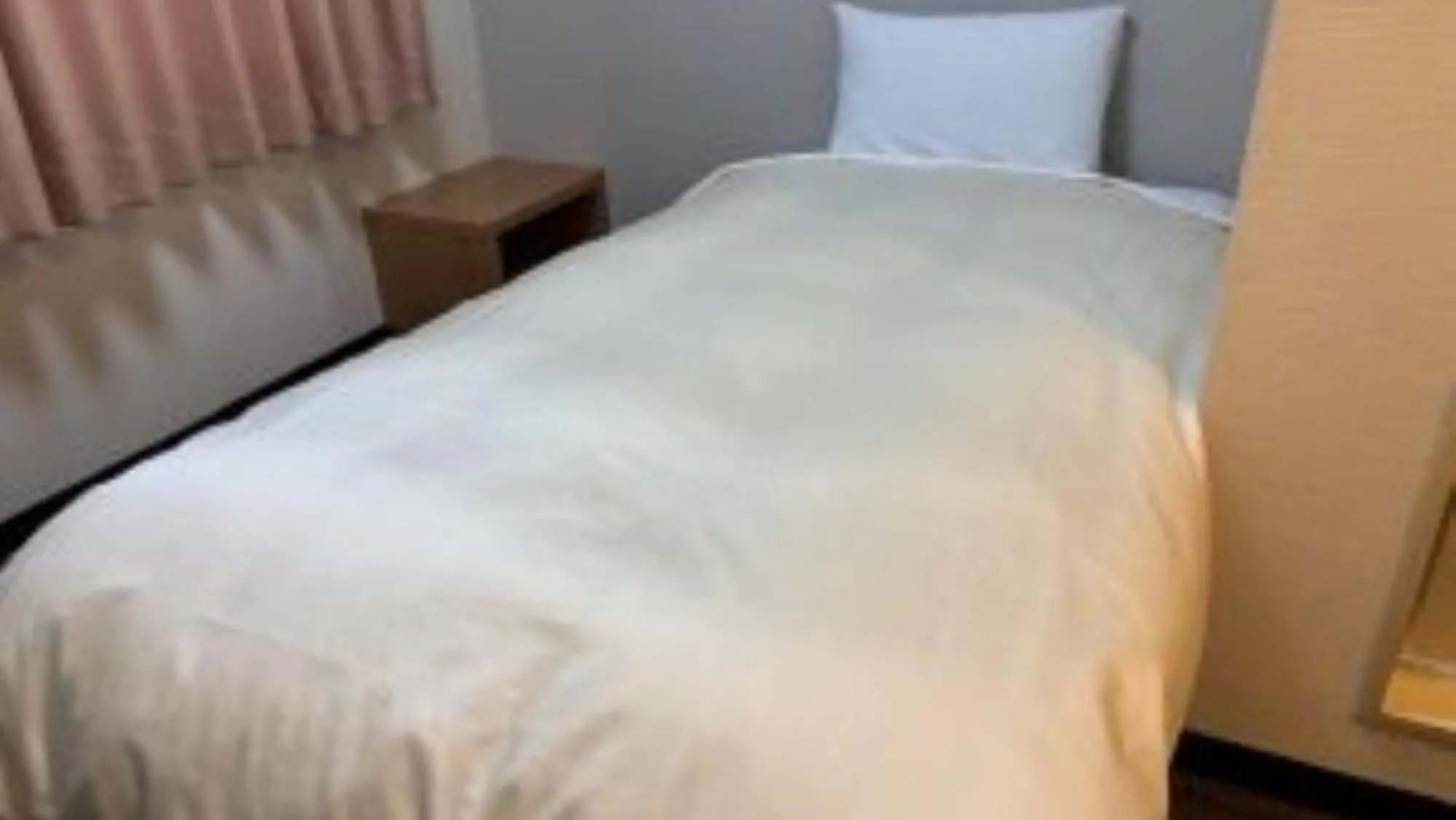 Bed in Hotel Niihama Hills Prince House