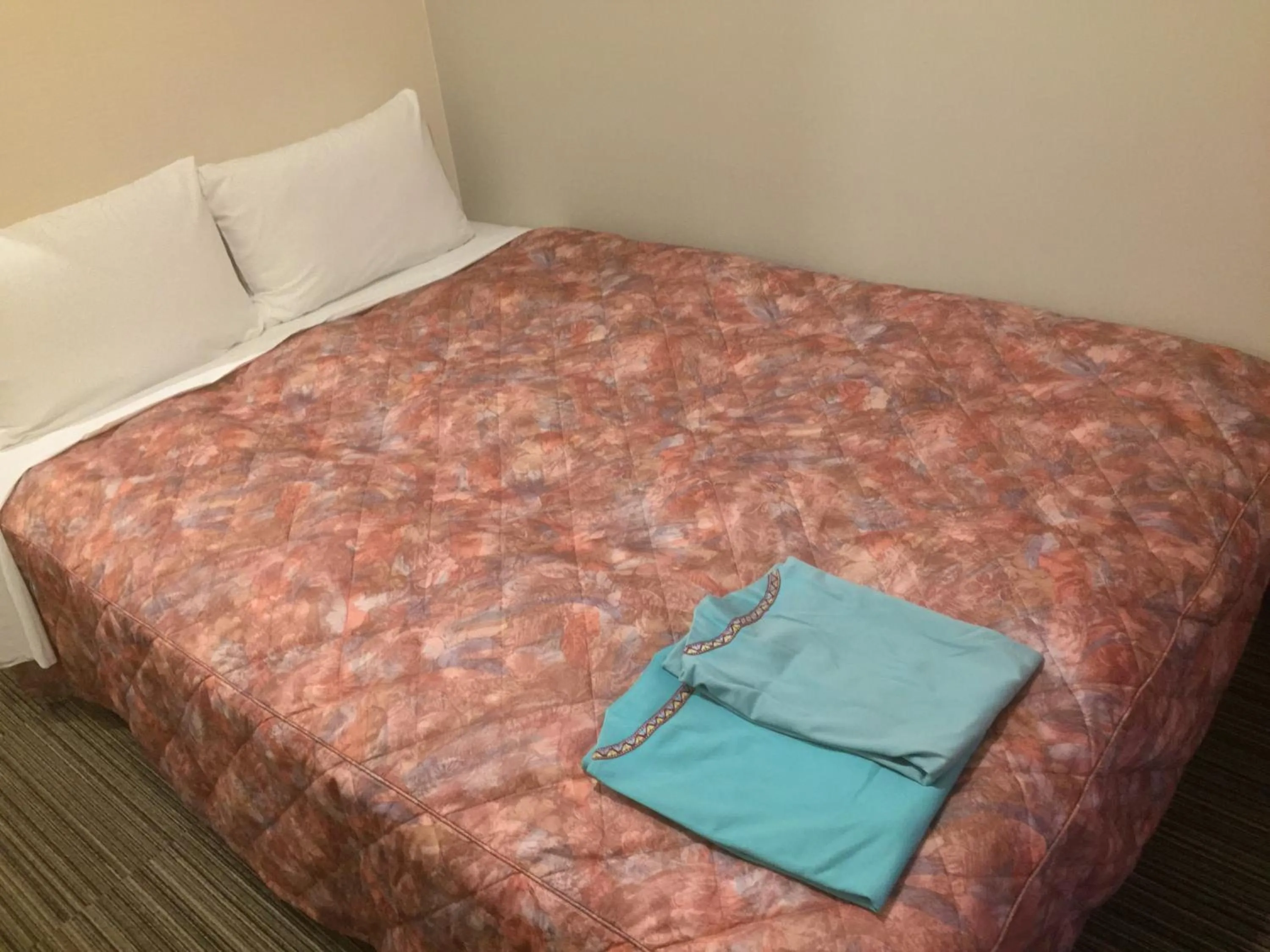 Bed in Hotel Niihama Hills Prince House